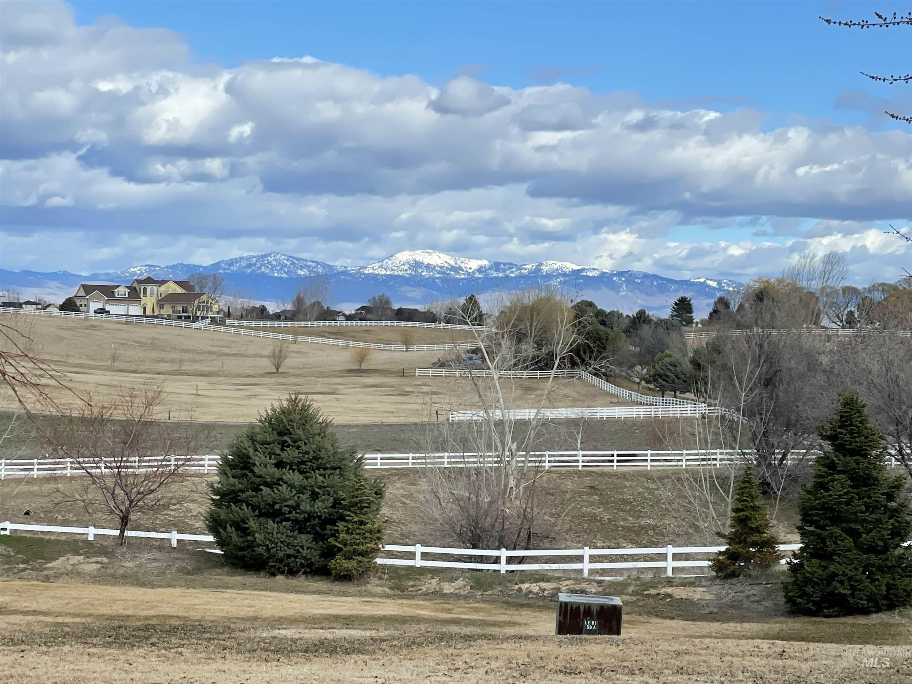 View of mountain backdrop featuring rural landscape