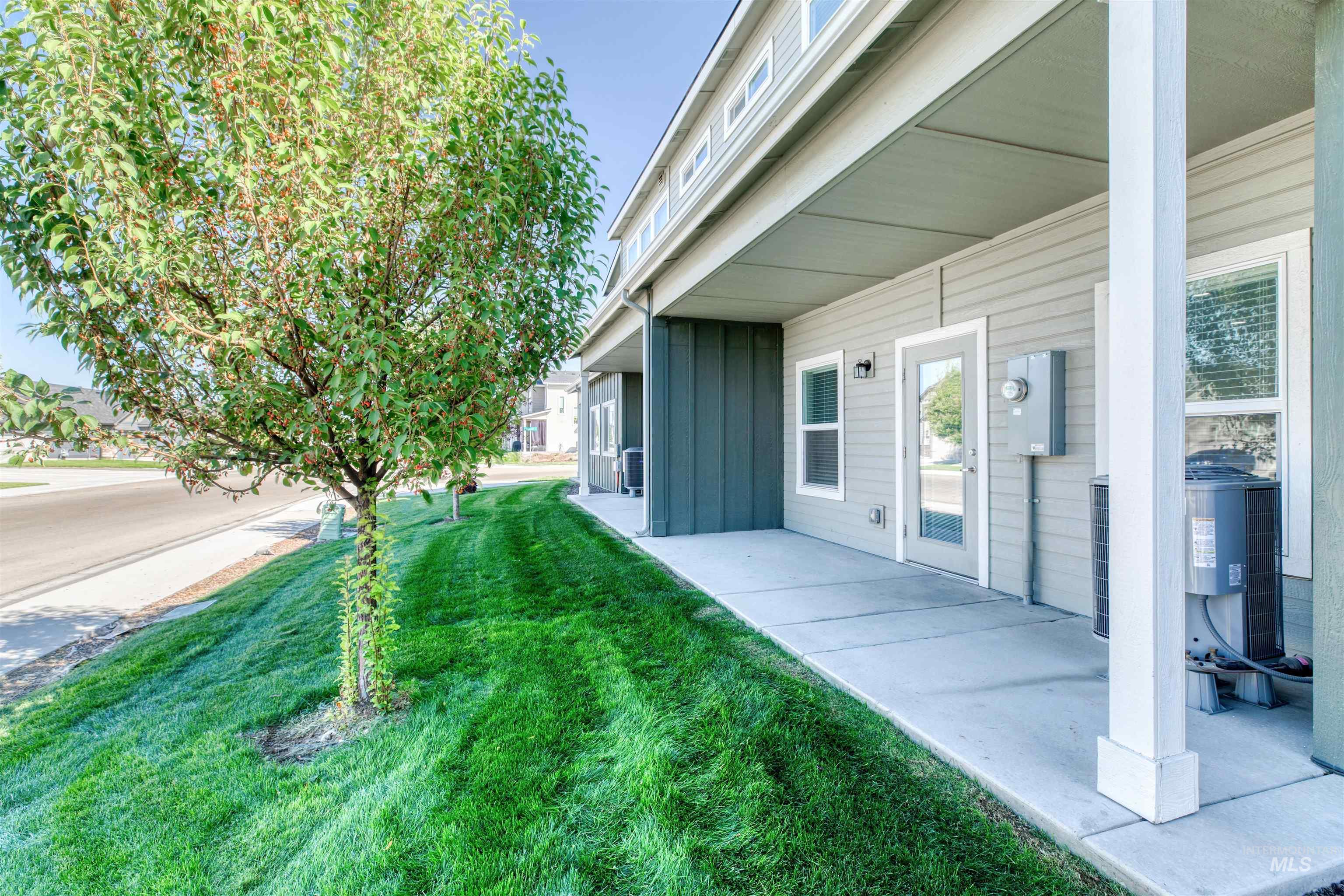 View of green lawn featuring a patio area