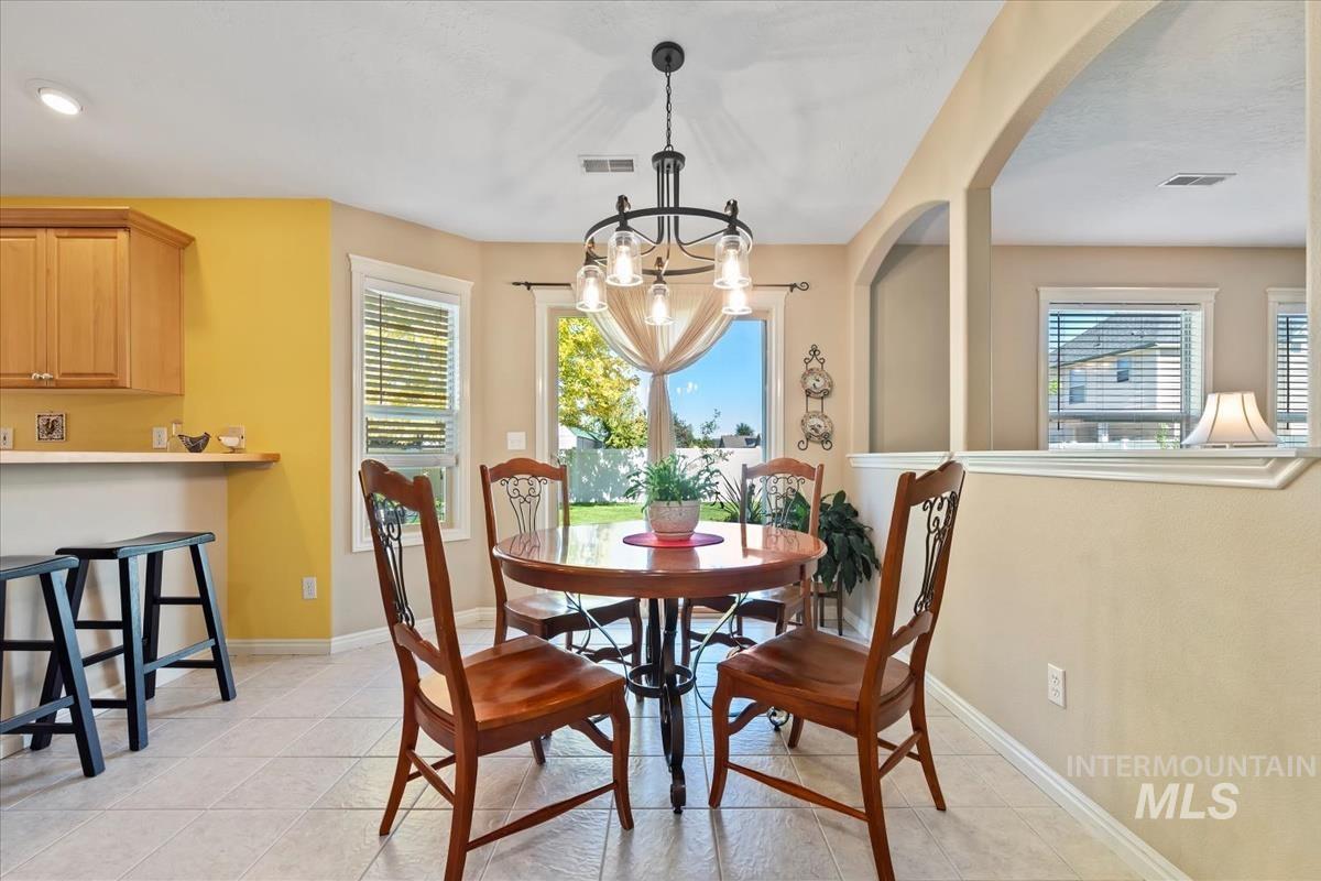 Dining area situated between the Kitchen and Living Room, slider to backyard.