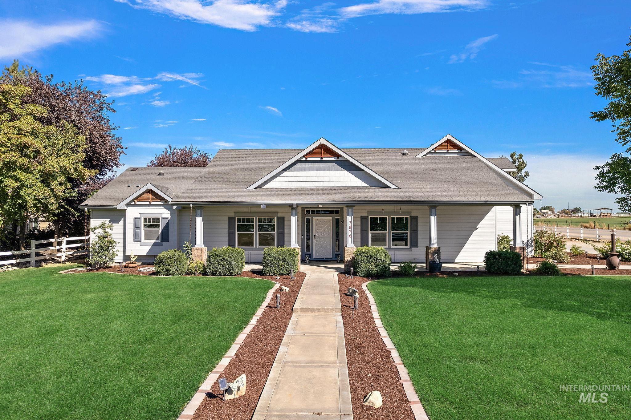 View of front of house featuring covered porch and roof with shingles