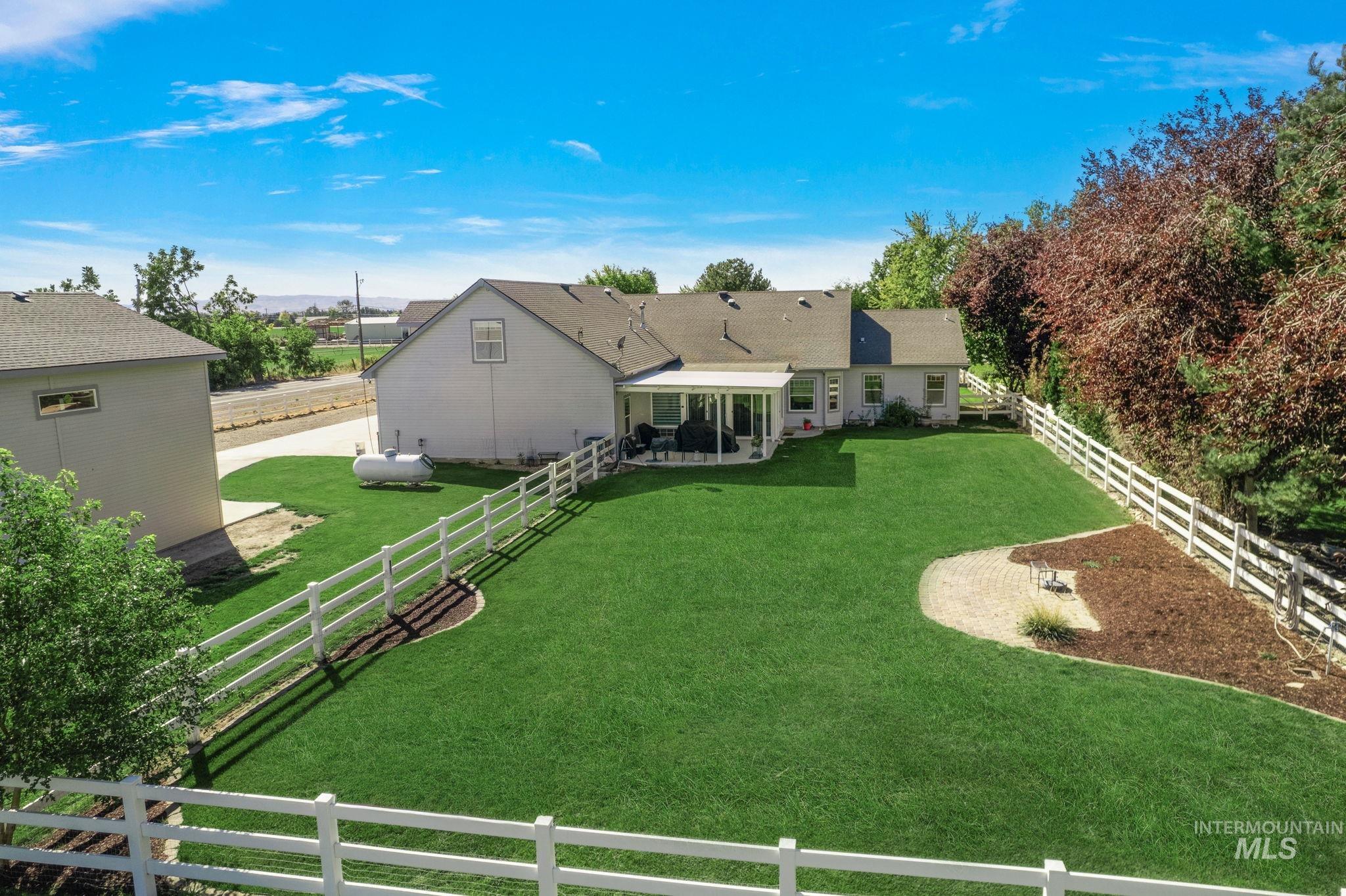 Fenced backyard with a patio area