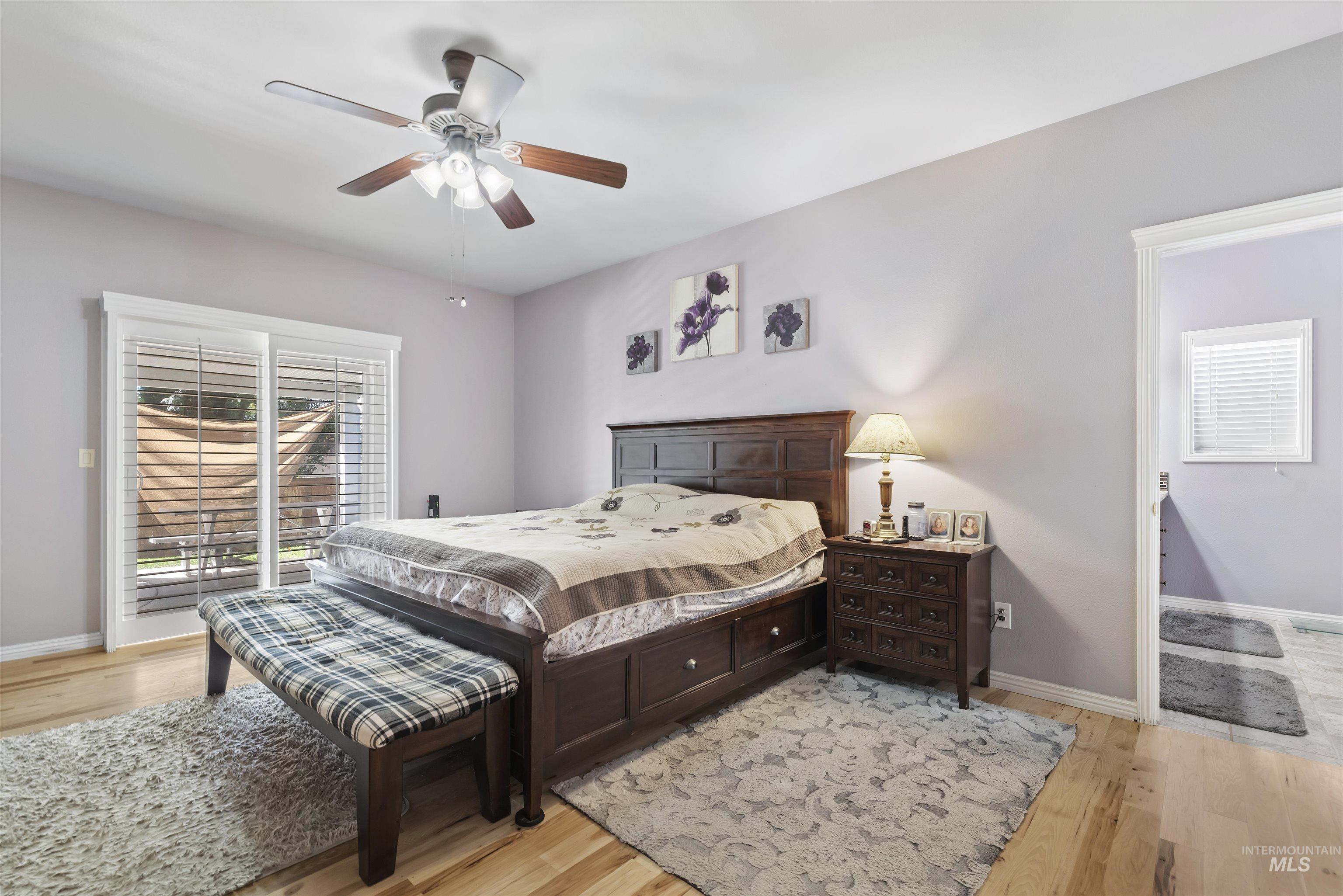 Bedroom featuring light wood-style floors and ceiling fan