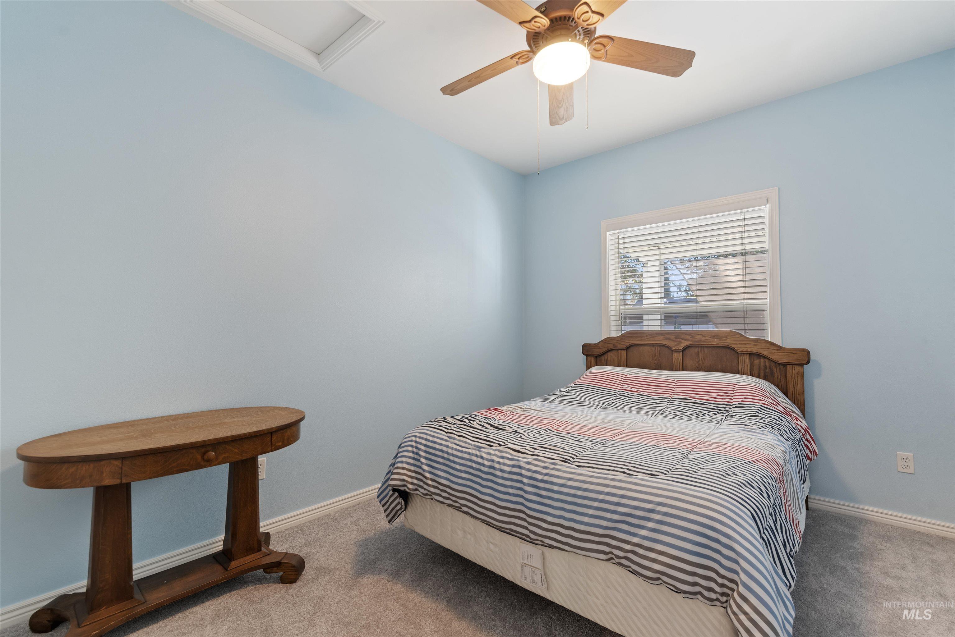 Bedroom featuring carpet flooring and a ceiling fan