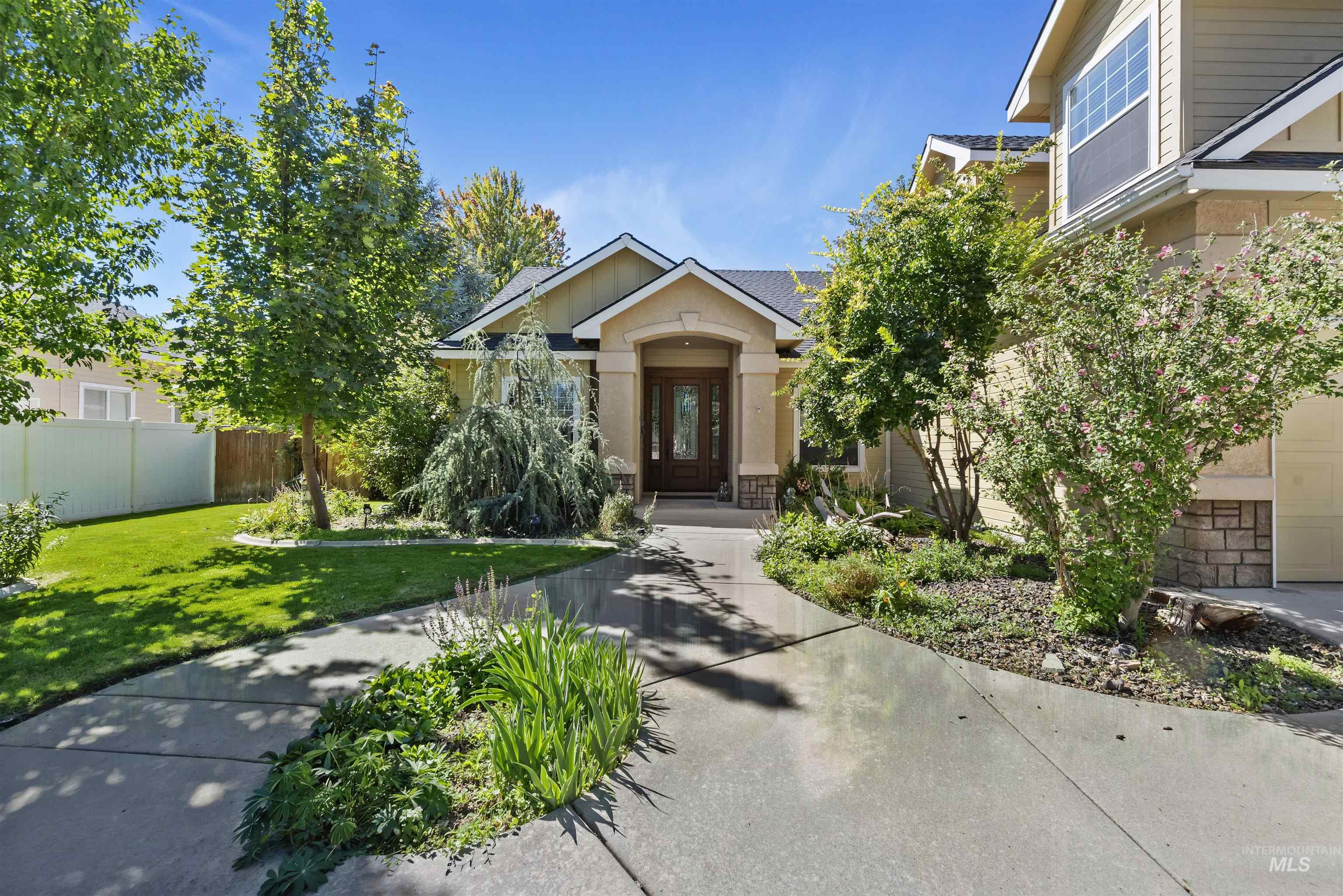 View of front of house with stone siding