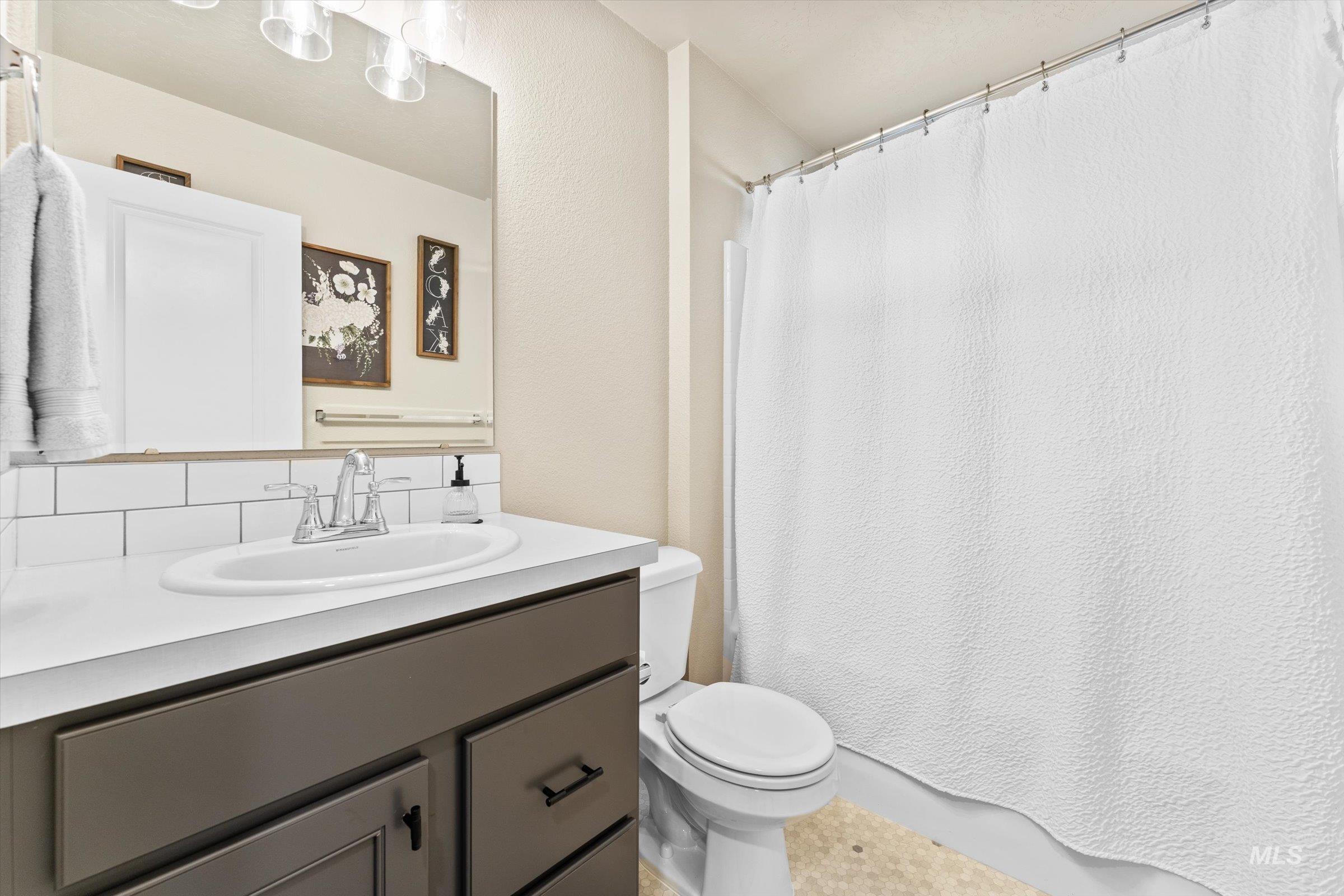 Bathroom with vanity and toilet