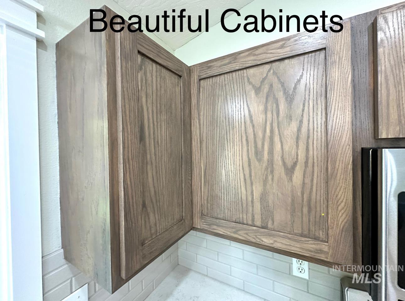 Kitchen view of stainless steel microwave and elevator