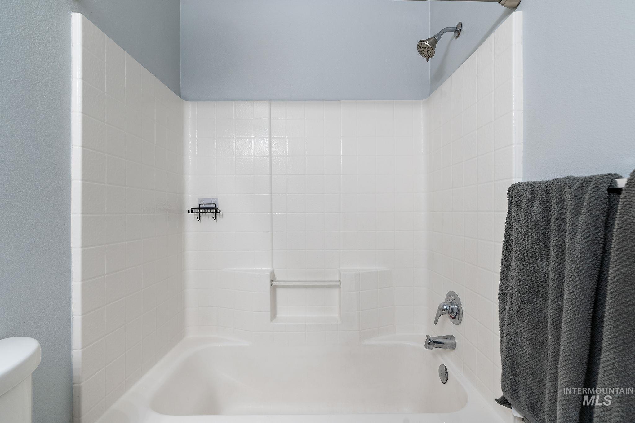 Full bath with bathing tub / shower combination and toilet