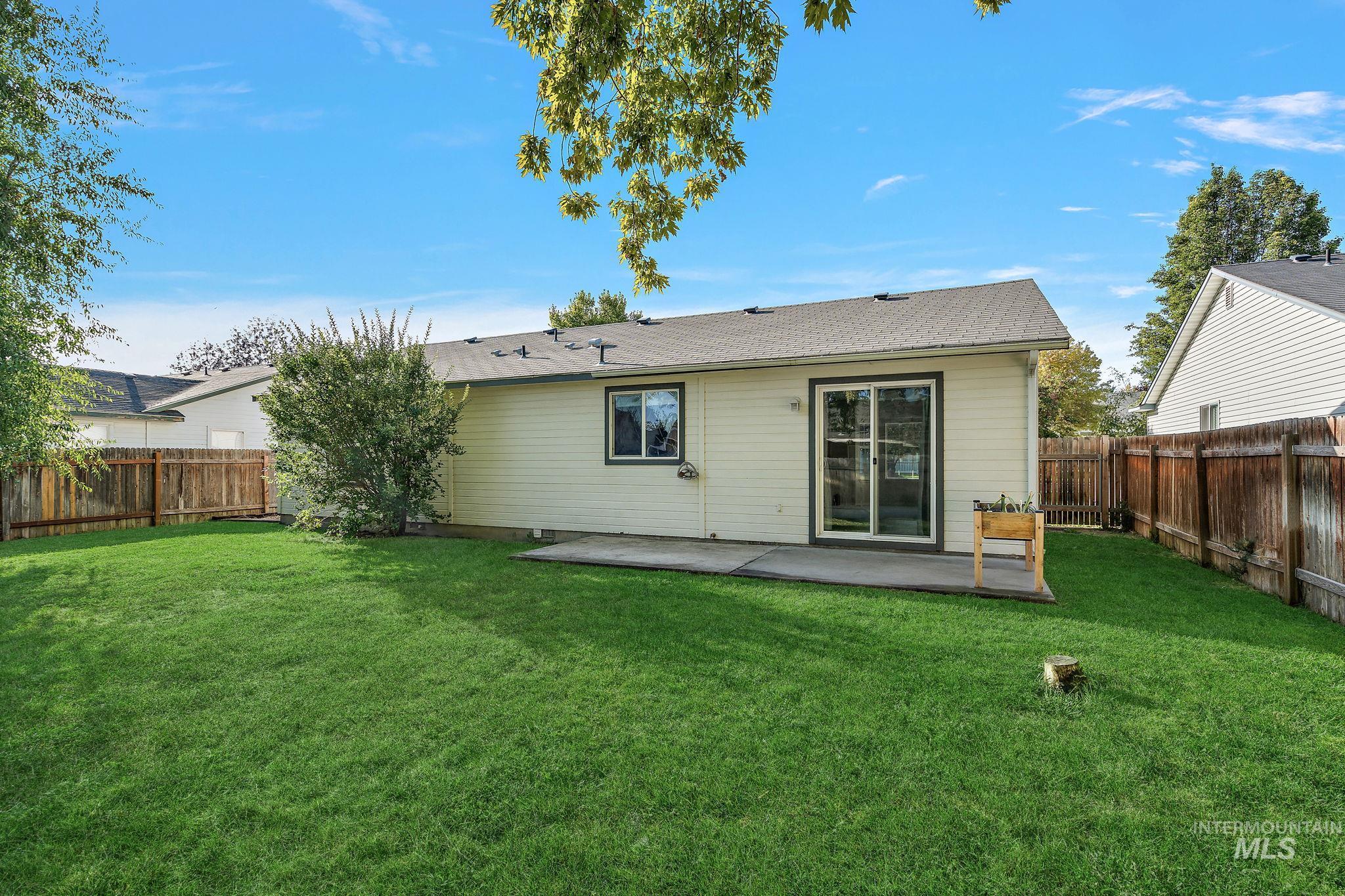 Back of house featuring a fenced backyard and a patio area