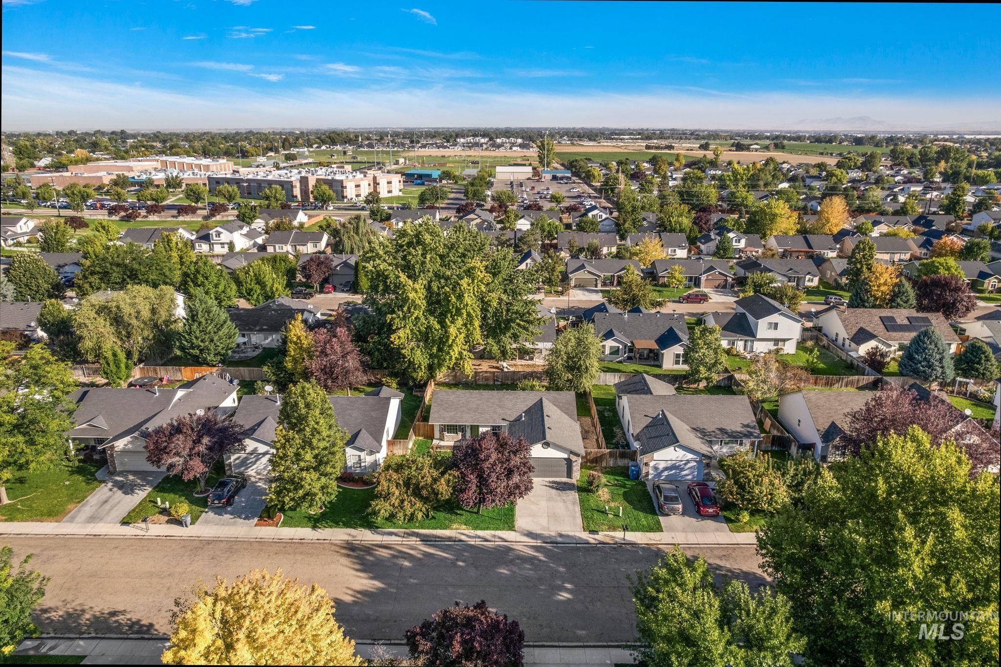 Aerial view of property's location featuring nearby suburban area