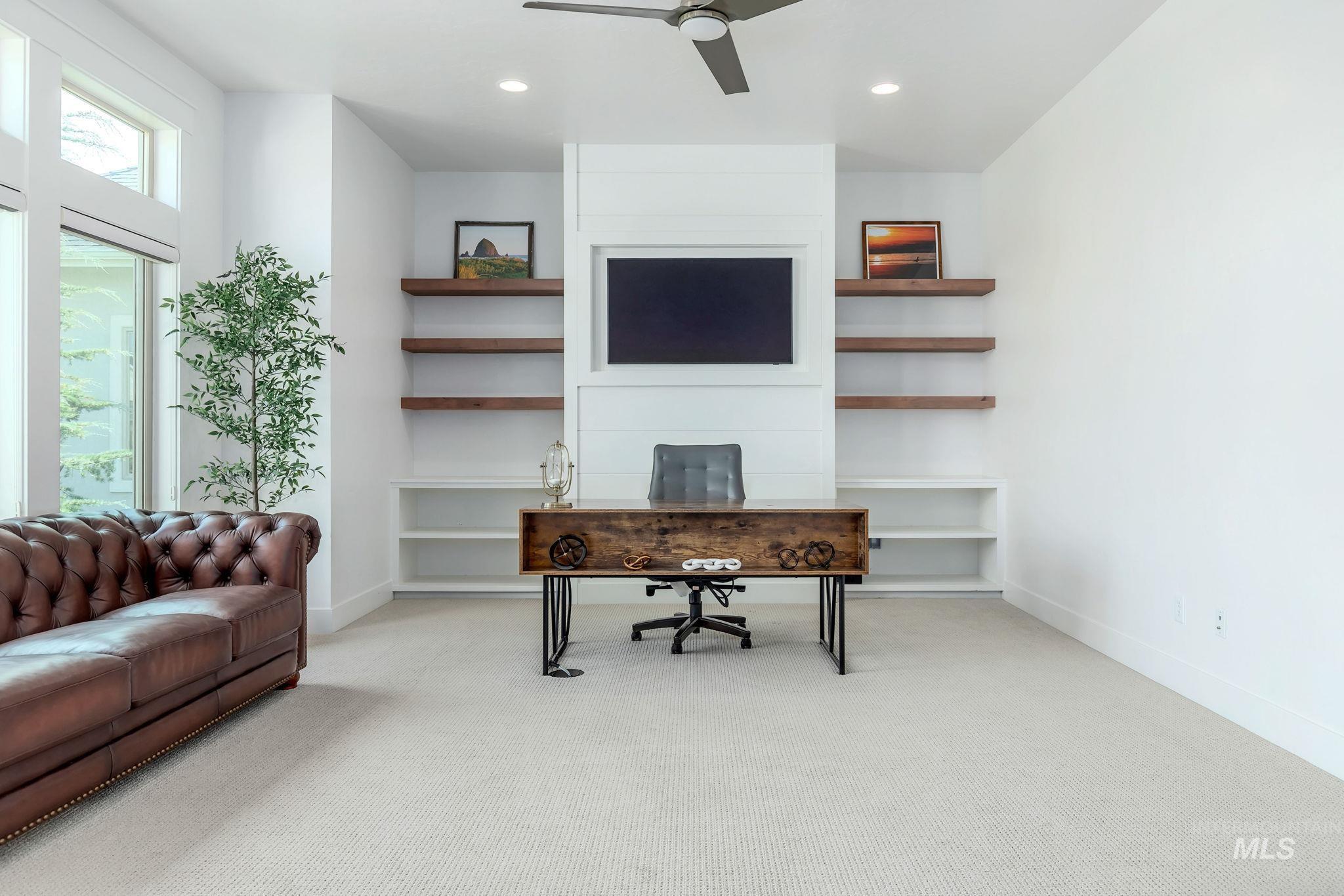 Office area featuring light colored carpet, ceiling fan, and recessed lighting