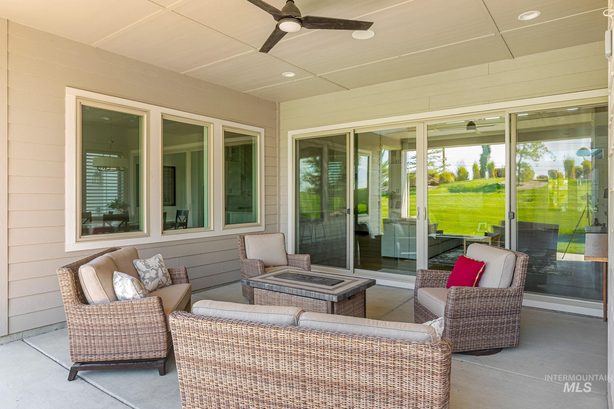 View of patio / terrace with ceiling fan and an outdoor living space