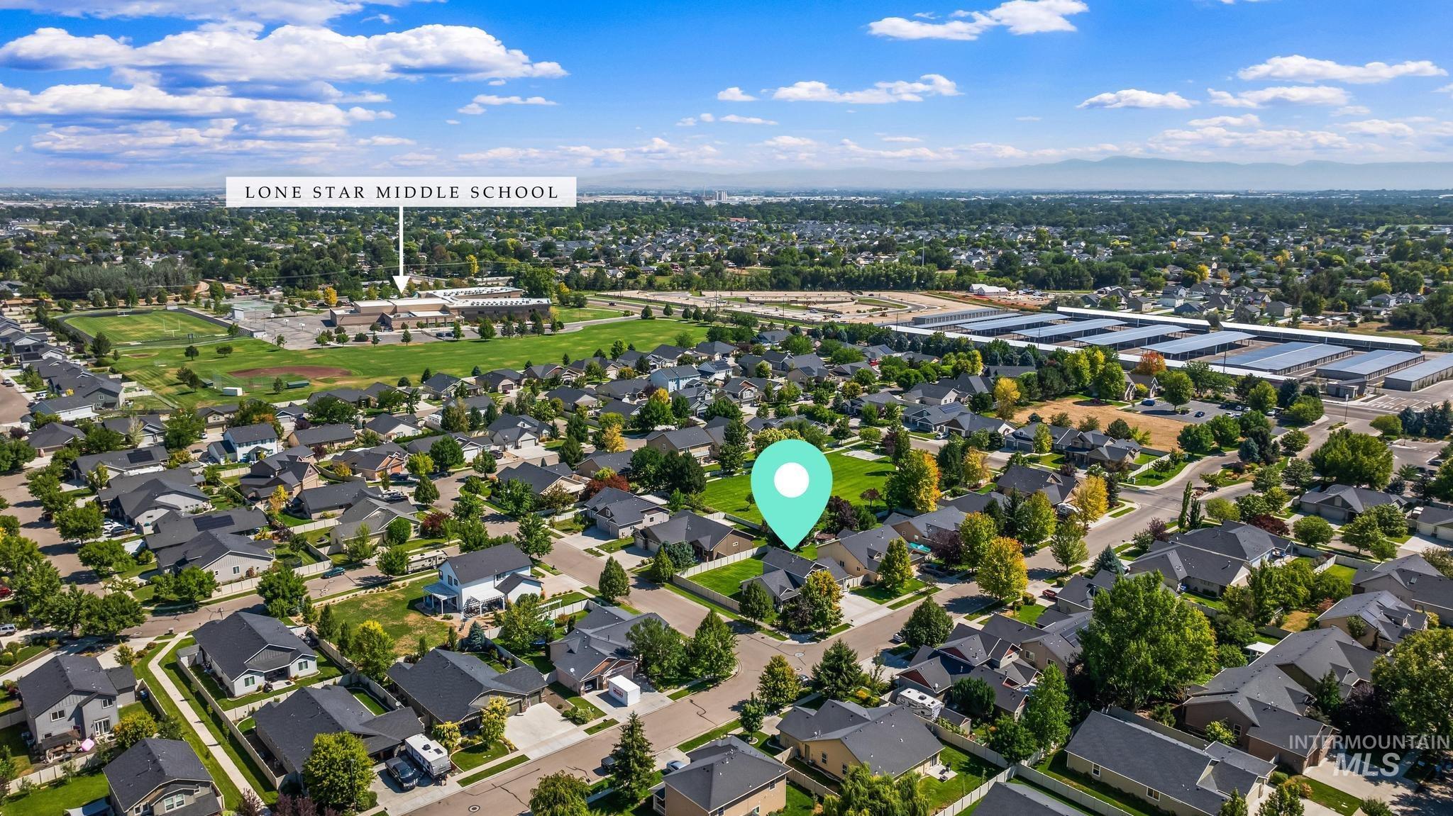 Aerial perspective of suburban area featuring a tree filled landscape