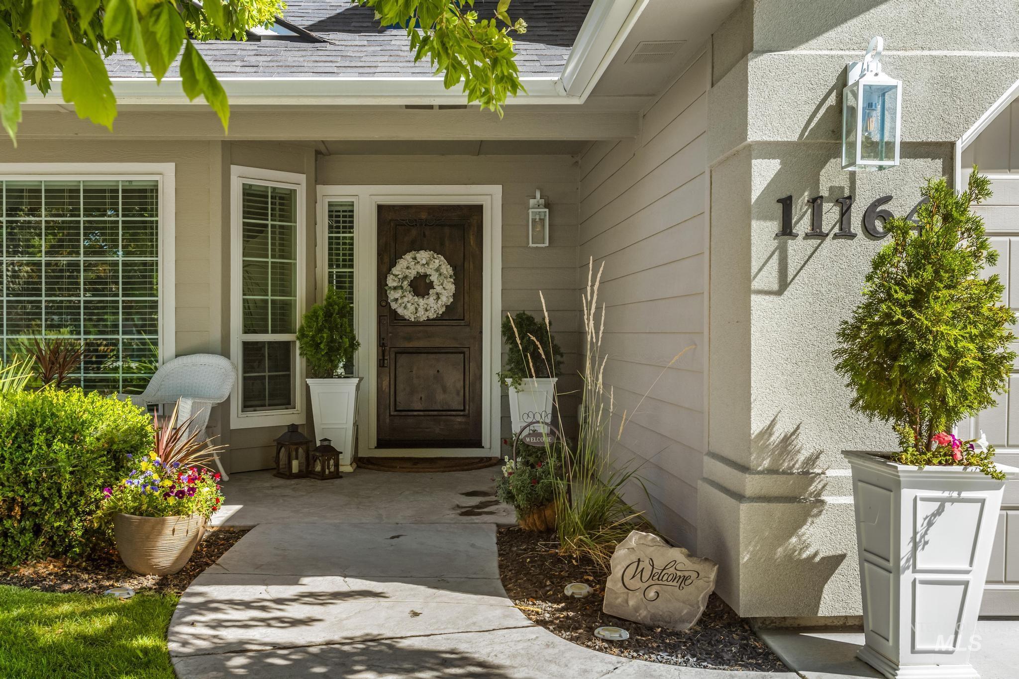 Entrance to property with a shingled roof