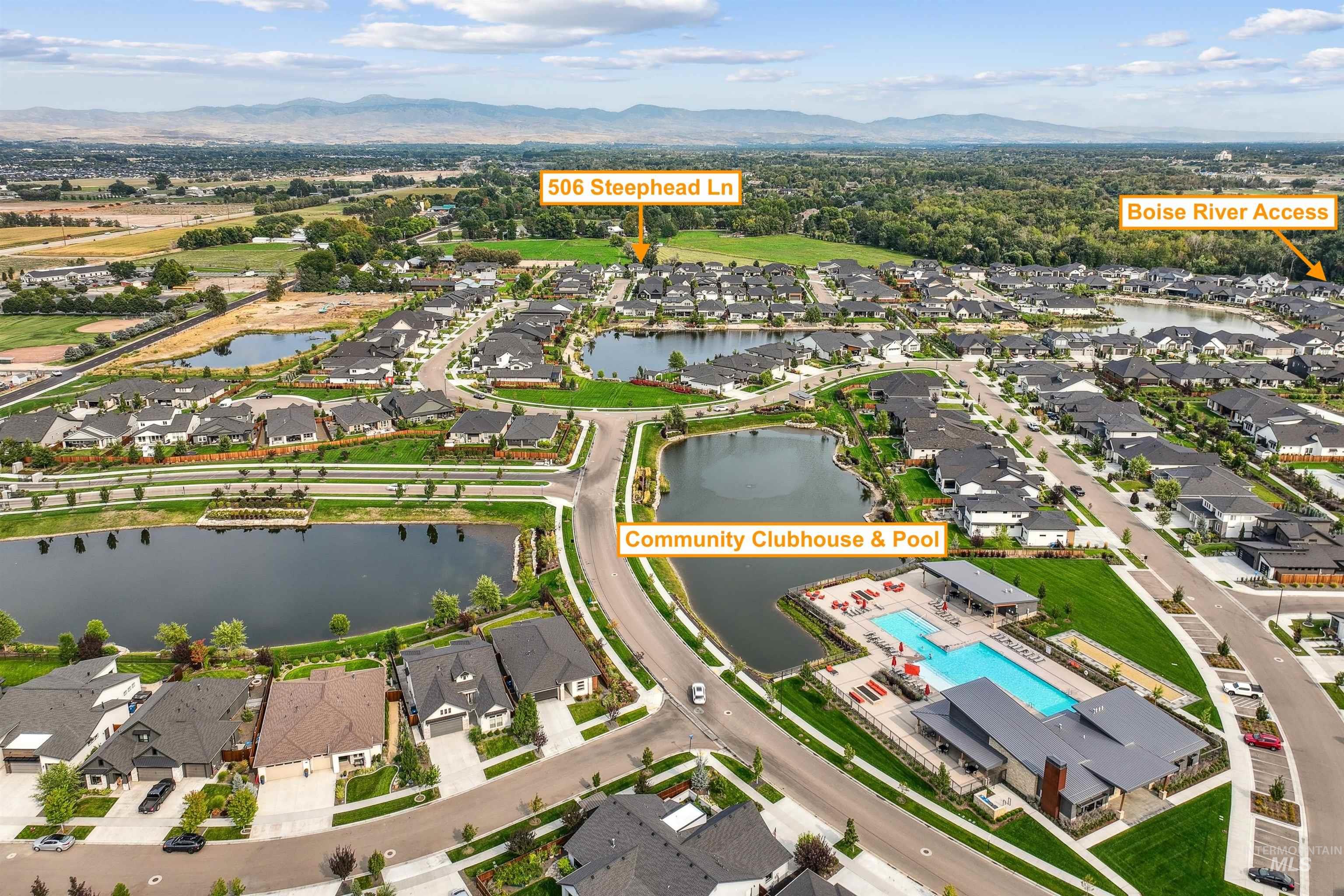 Aerial view of residential area featuring a water and mountain view