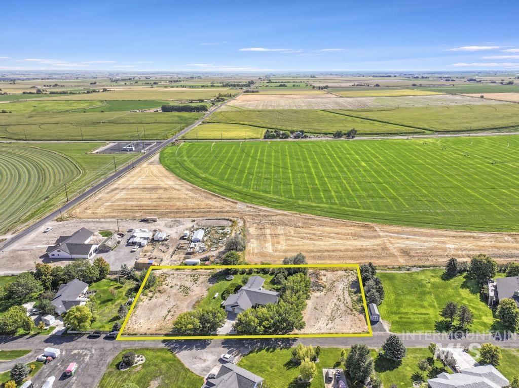 View of rural area featuring abundant farmland and property parcel outlined