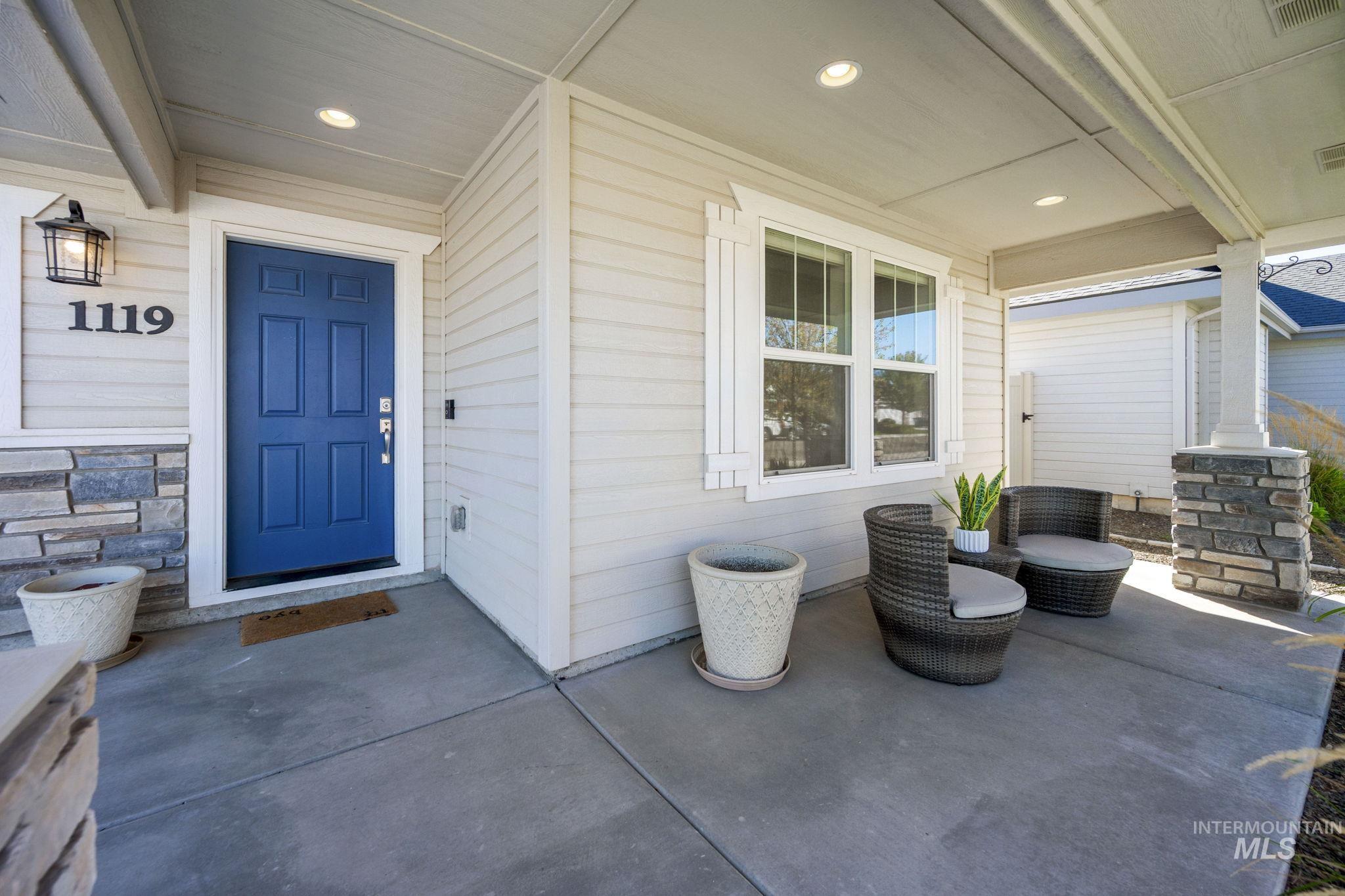 Doorway to property with covered porch