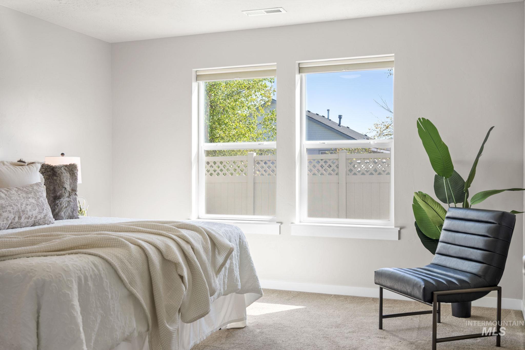 Carpeted bedroom with baseboards