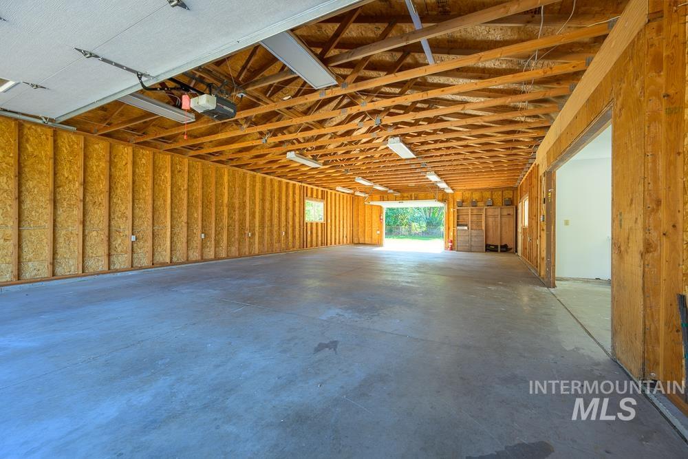 Garage featuring a garage door opener