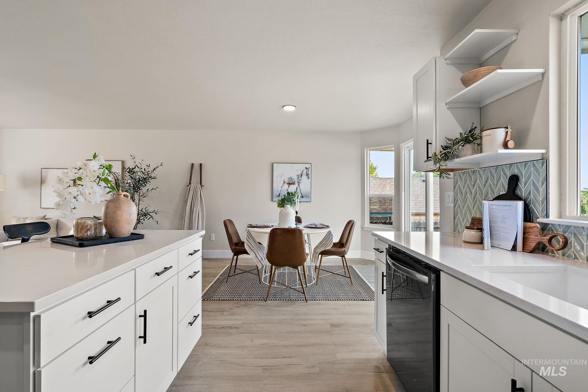 Kitchen featuring open shelves, light wood-style flooring, white cabinetry, black dishwasher, and recessed lighting