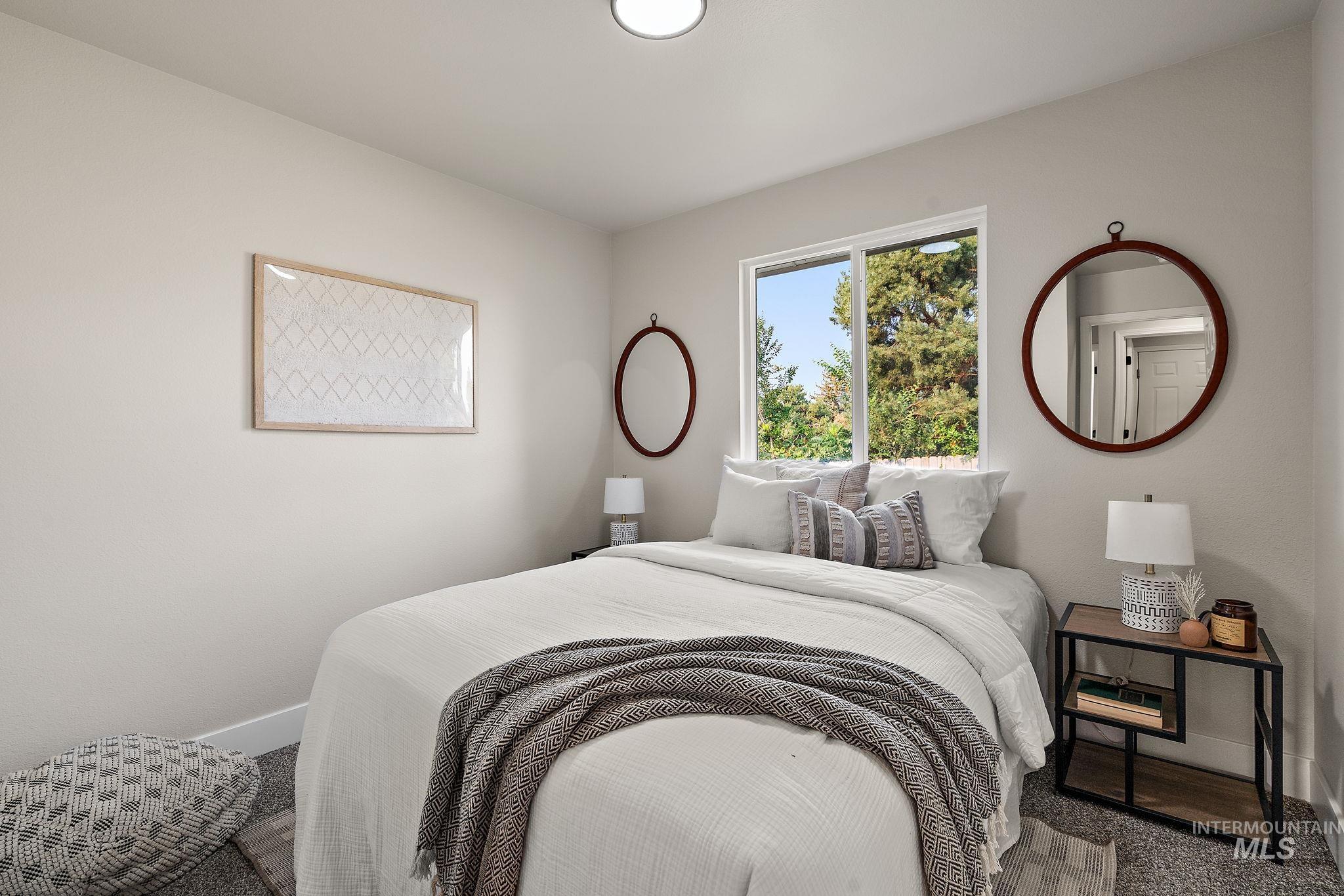Bedroom featuring baseboards and carpet flooring