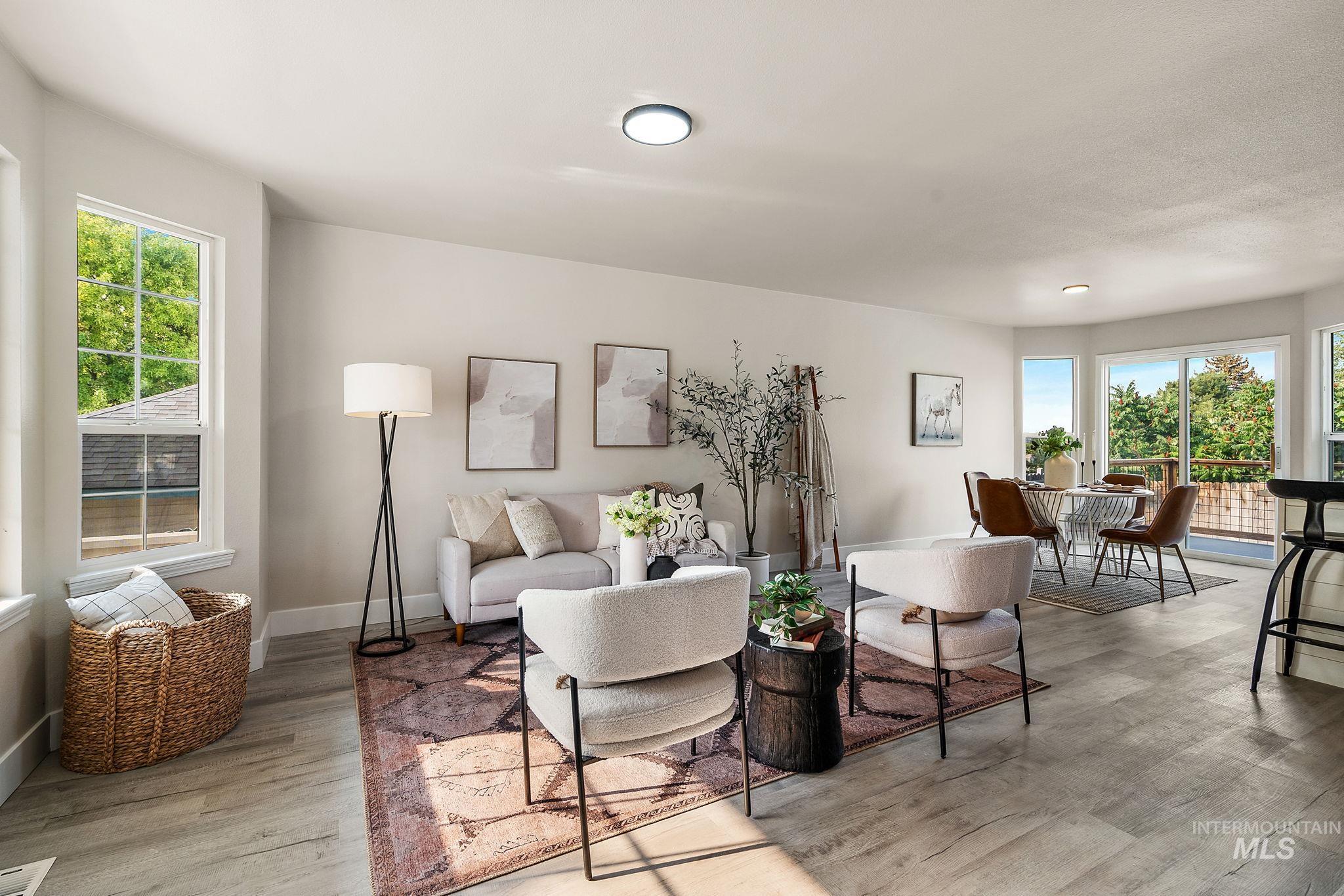 Living area featuring light wood finished floors and baseboards