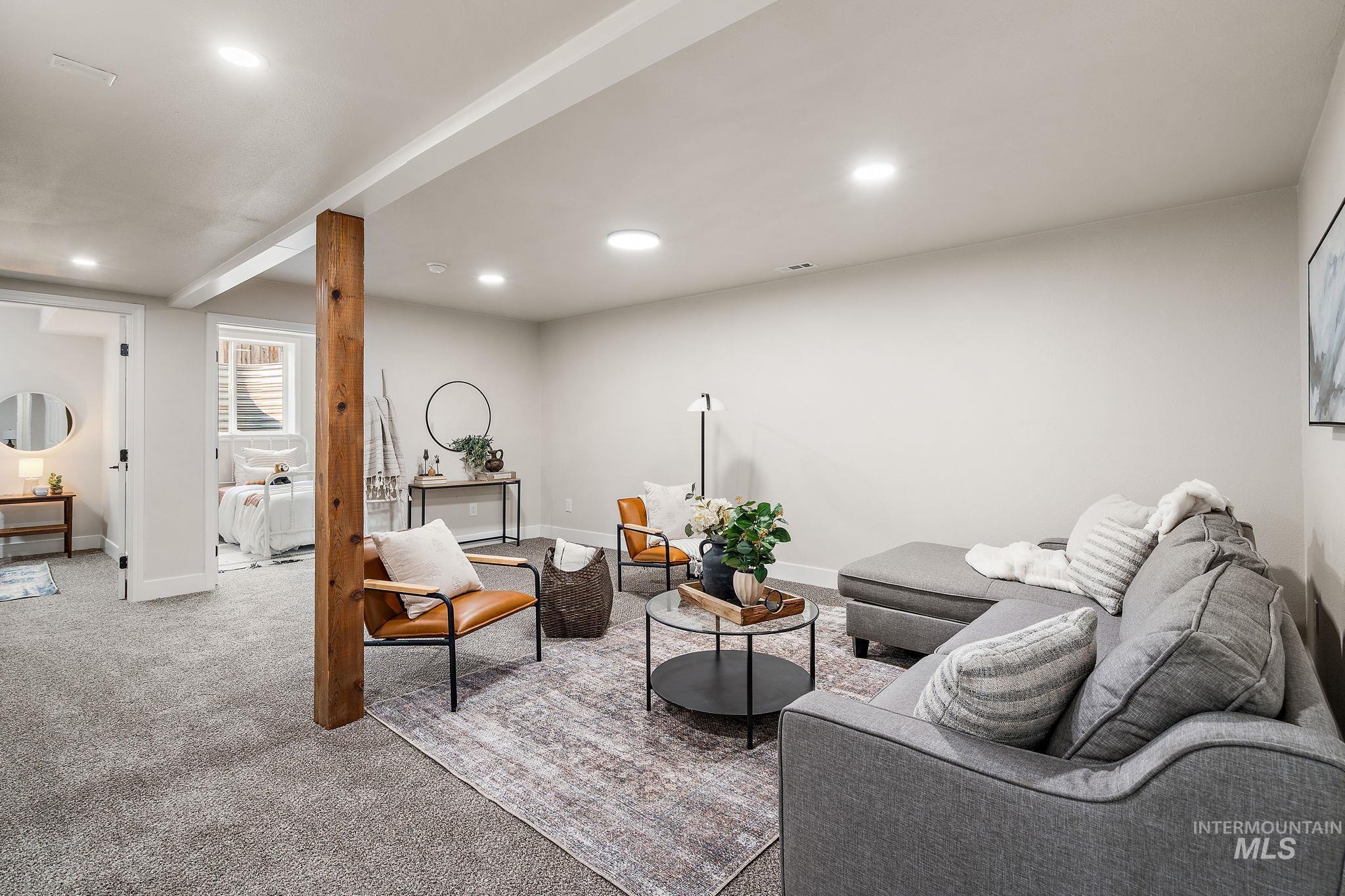 Living area featuring carpet flooring and recessed lighting