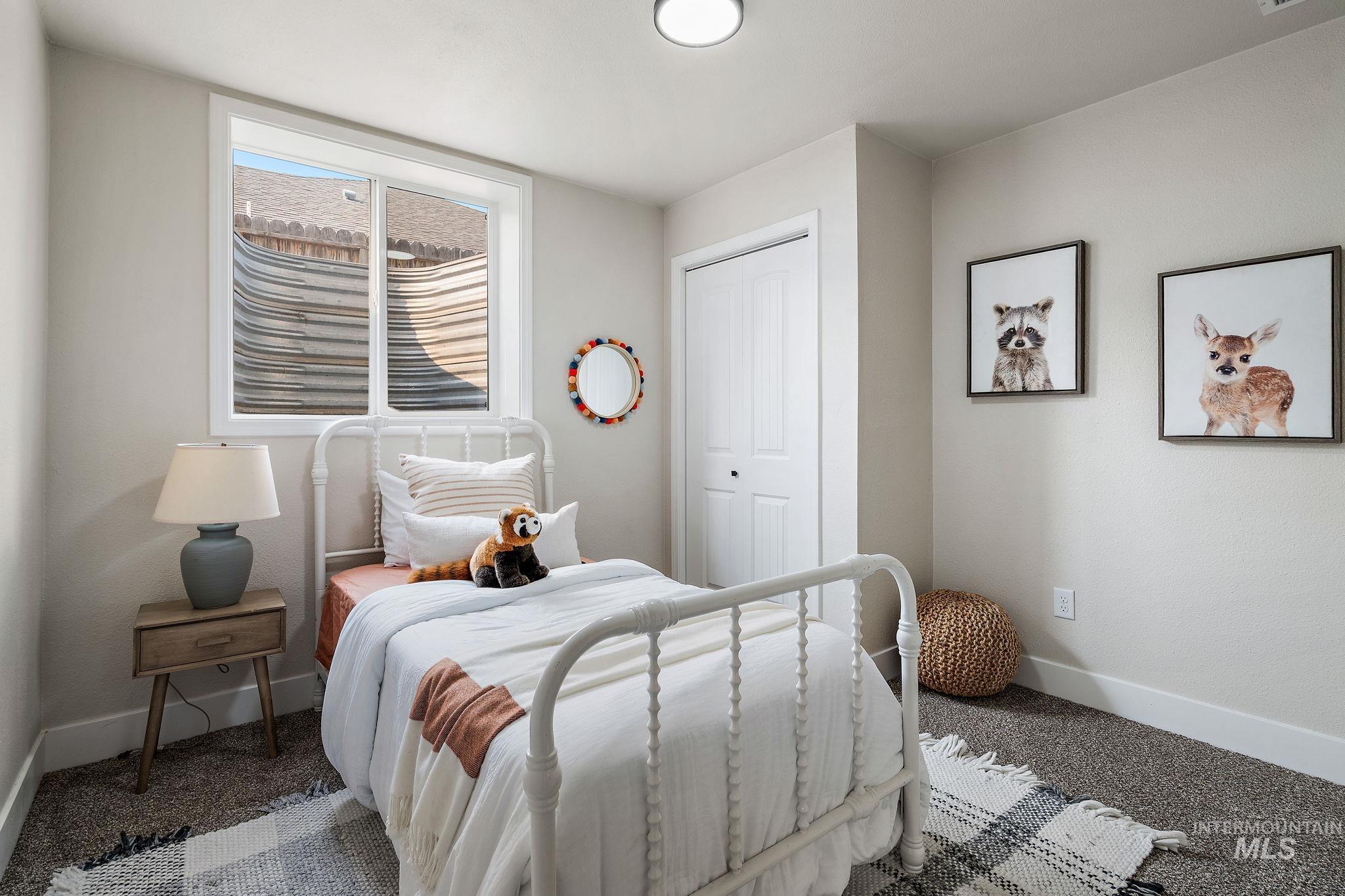 Bedroom featuring carpet floors and a closet