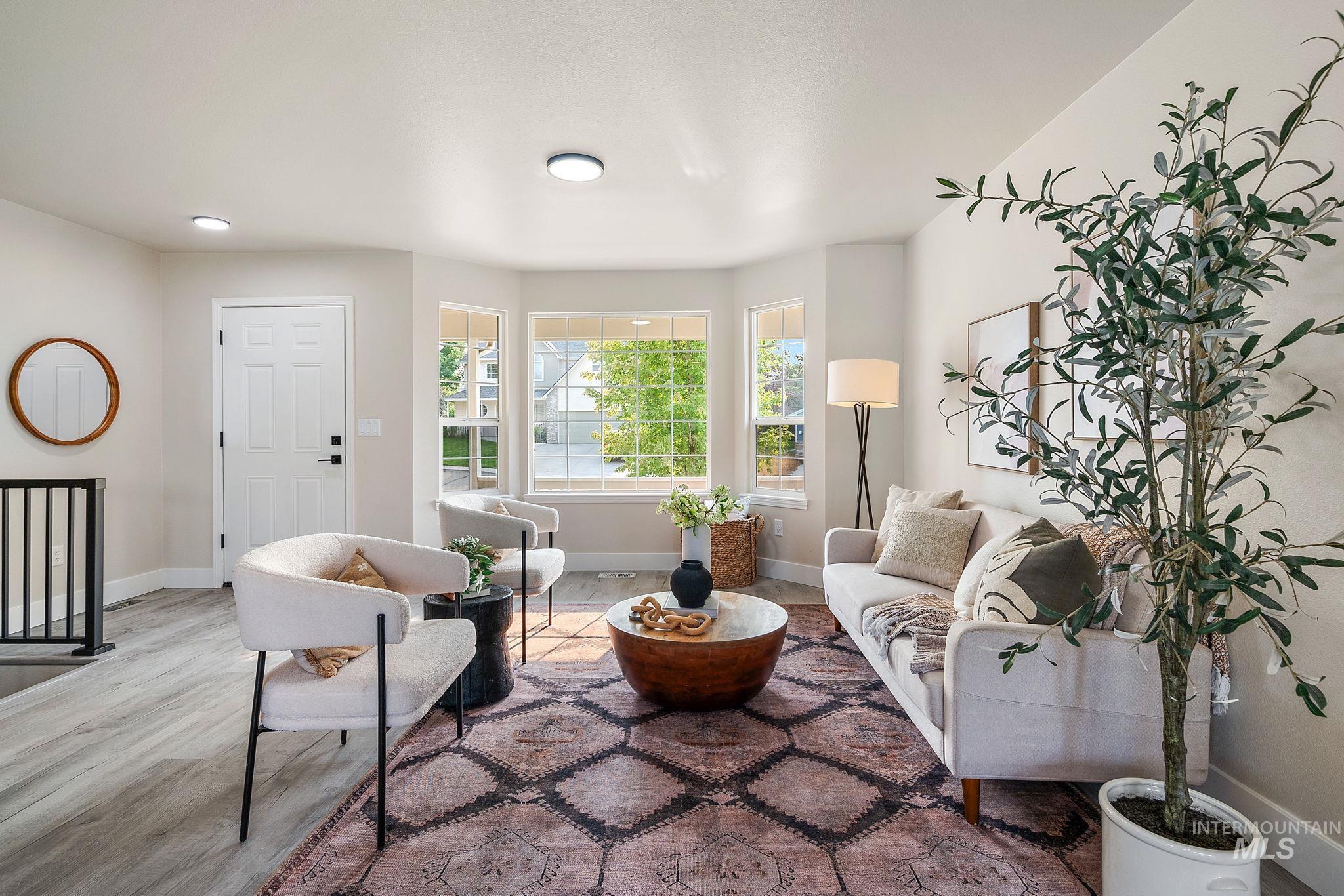 Living room featuring baseboards and wood finished floors