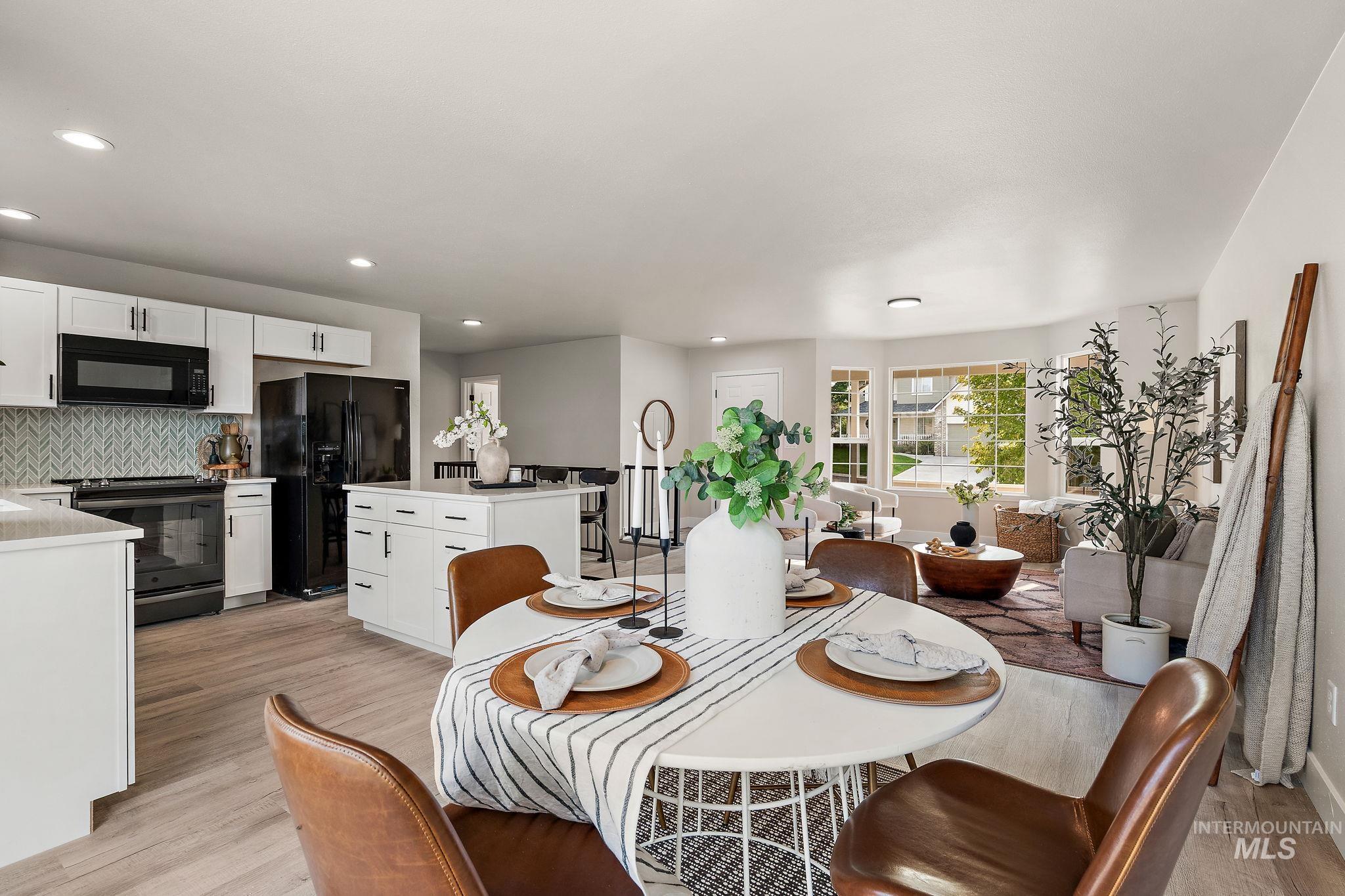 Dining room featuring light wood-style flooring and recessed lighting