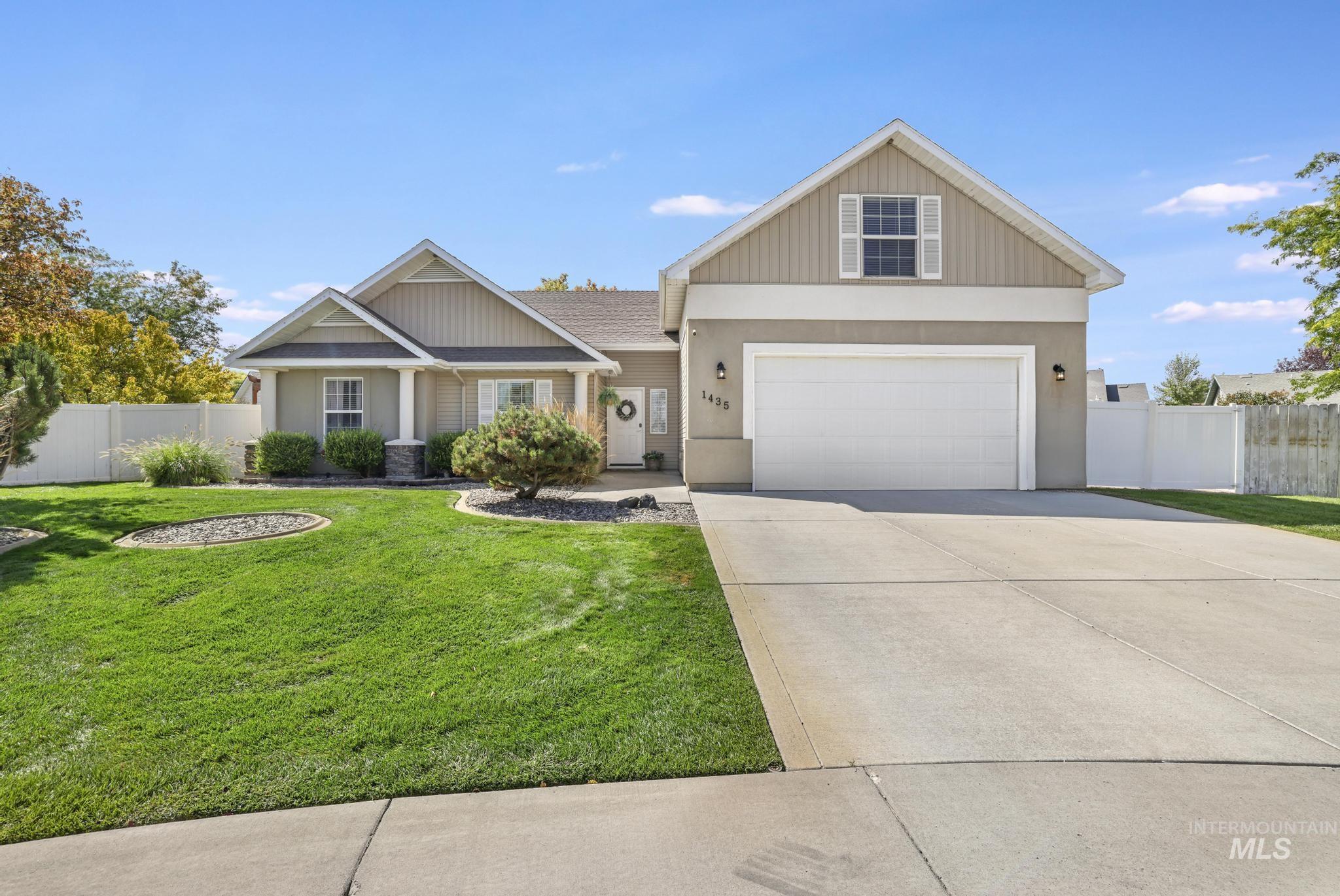 Craftsman inspired home featuring concrete driveway and stucco siding