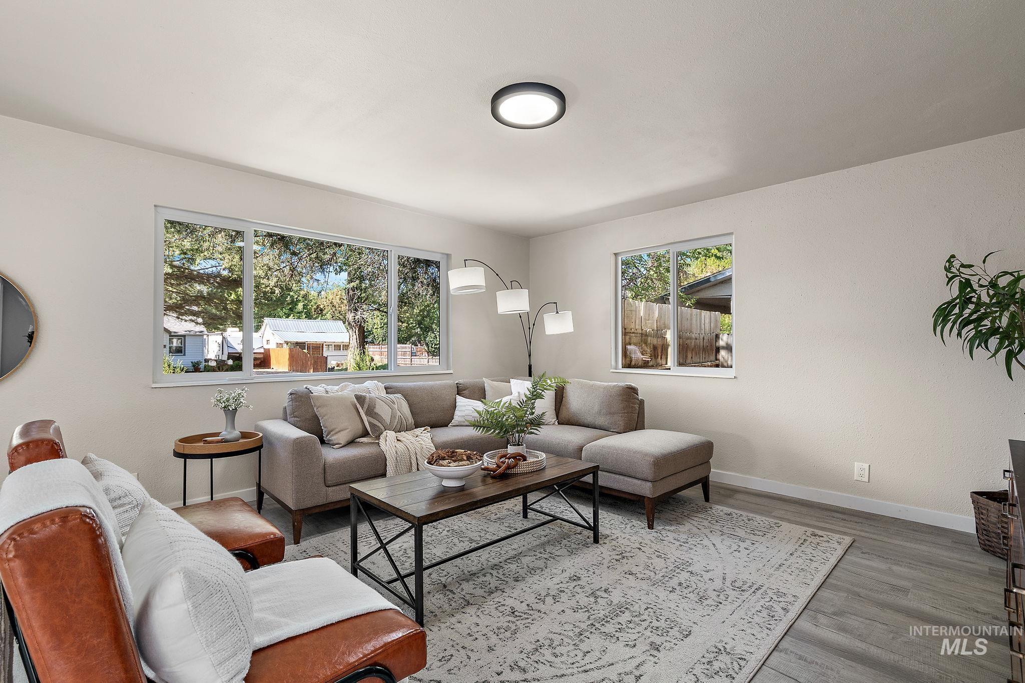 Living room featuring baseboards and light wood finished floors