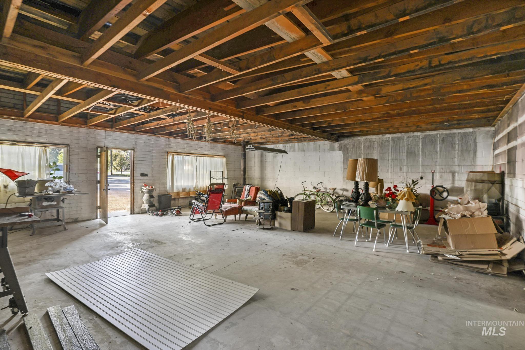 Miscellaneous room with concrete floors