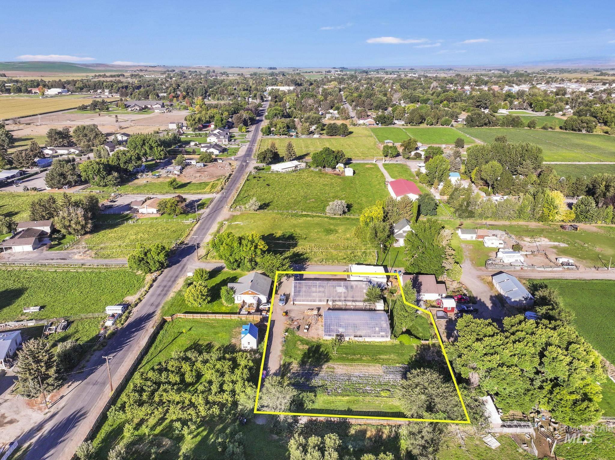 Aerial view of sparsely populated area with property boundaries highlighted