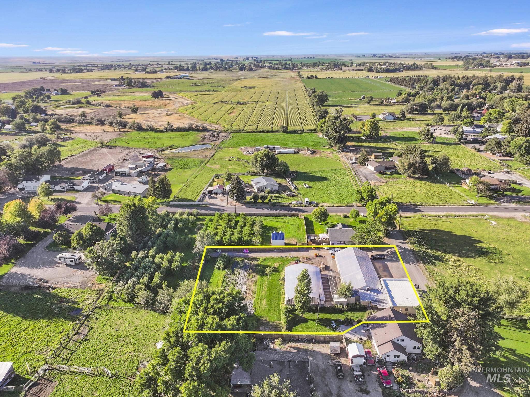 View of rural area featuring property parcel outlined and extensive farmland