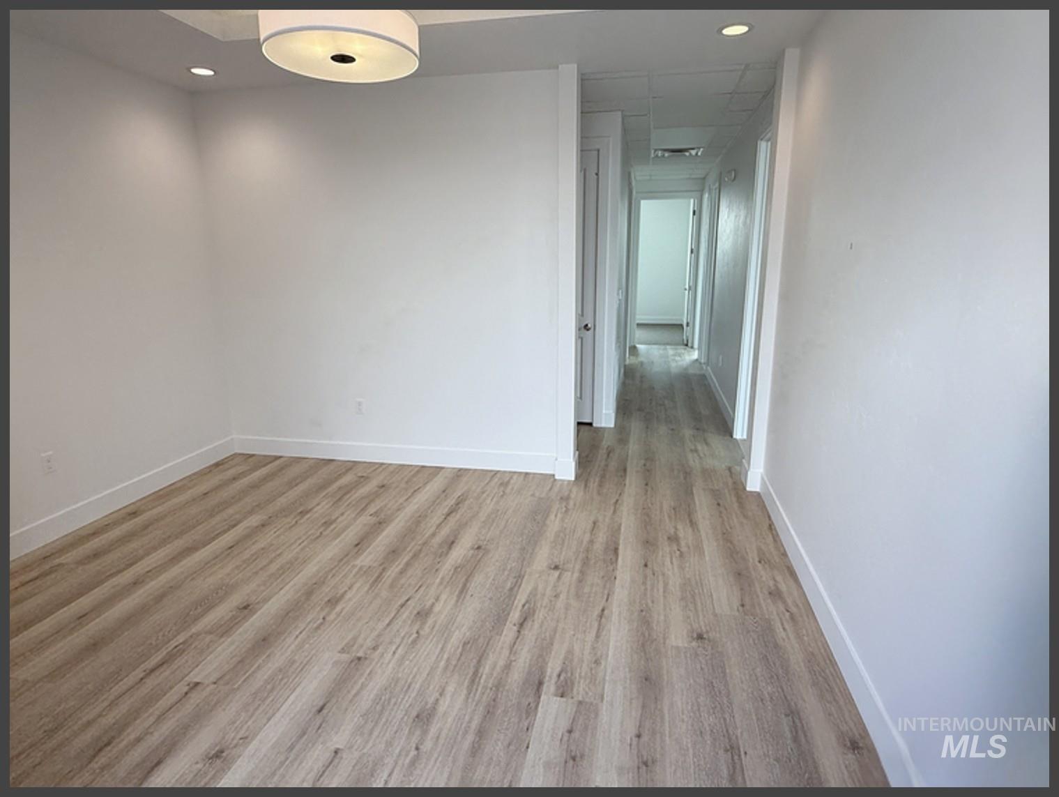 Unfurnished room featuring light wood-style flooring and recessed lighting