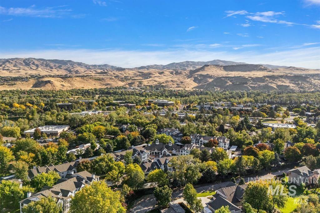 View of property location with a mountain backdrop and nearby suburban area