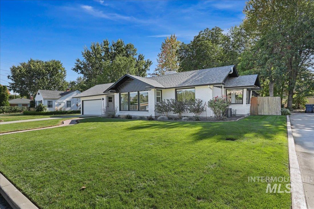 Single story home with a garage and driveway