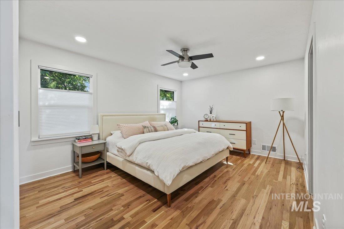Bedroom with recessed lighting, light wood-type flooring, and a ceiling fan