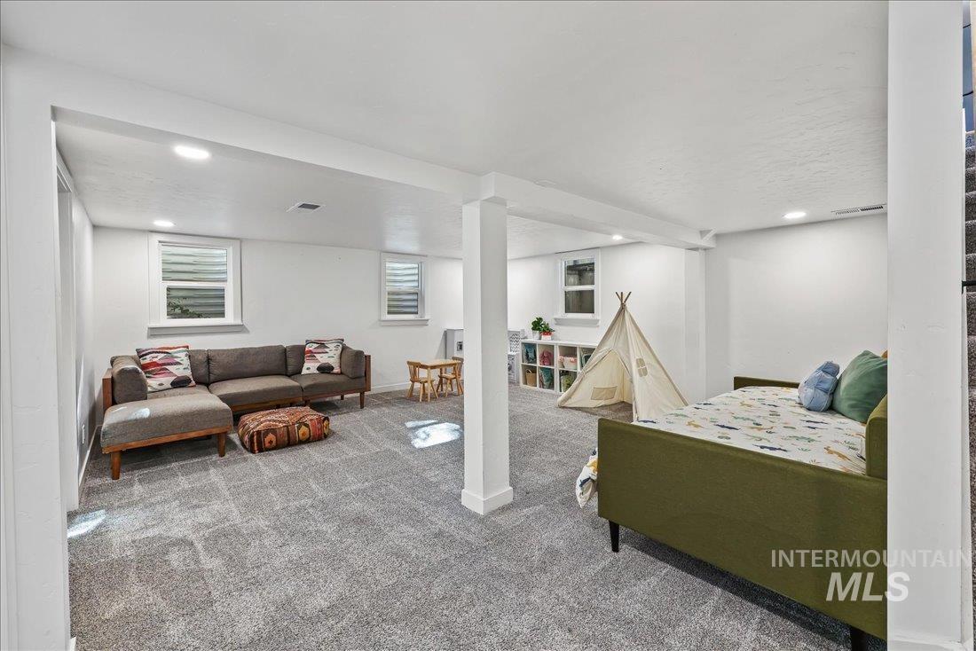 Bedroom with carpet floors and recessed lighting