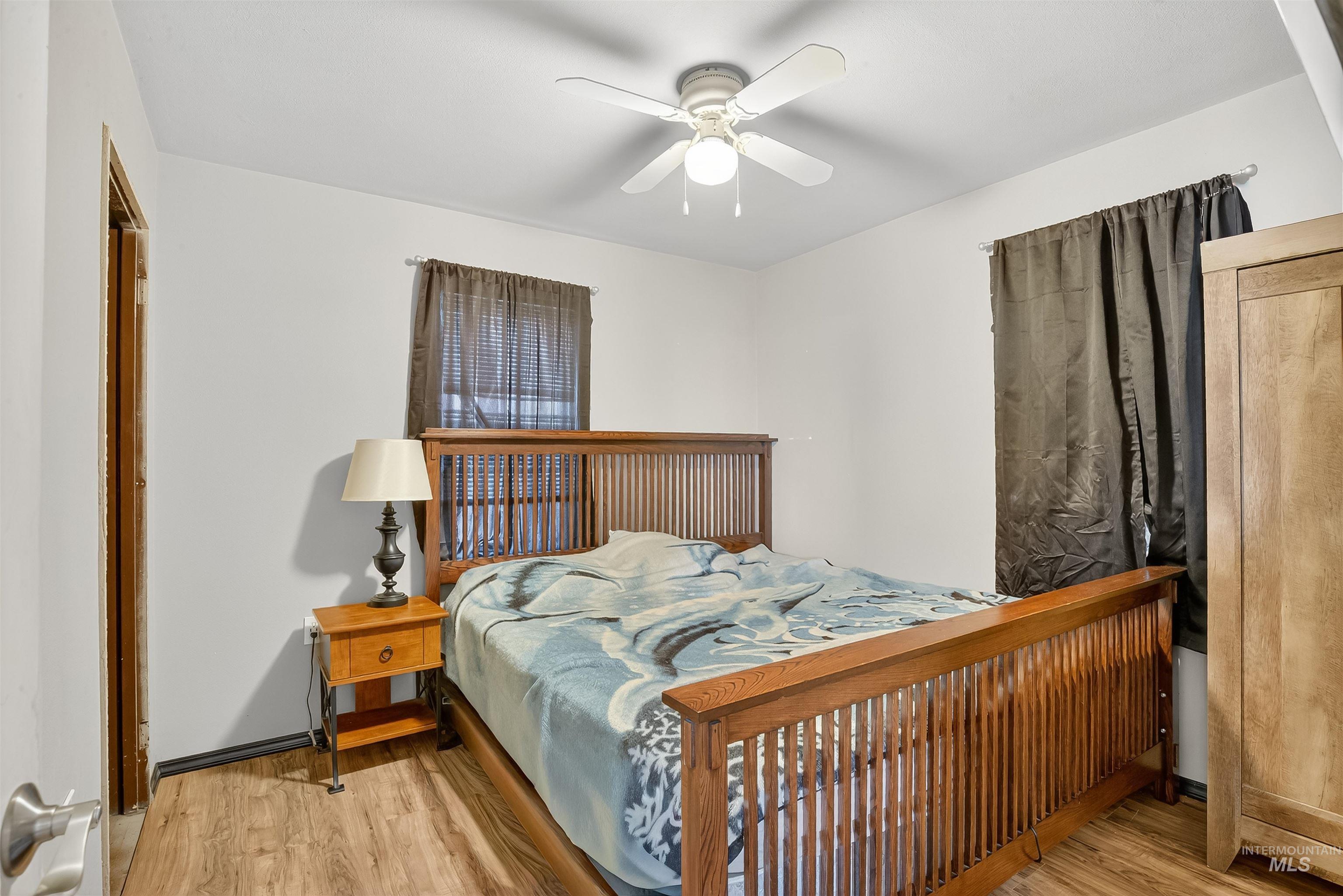 Bedroom featuring light wood-type flooring and ceiling fan