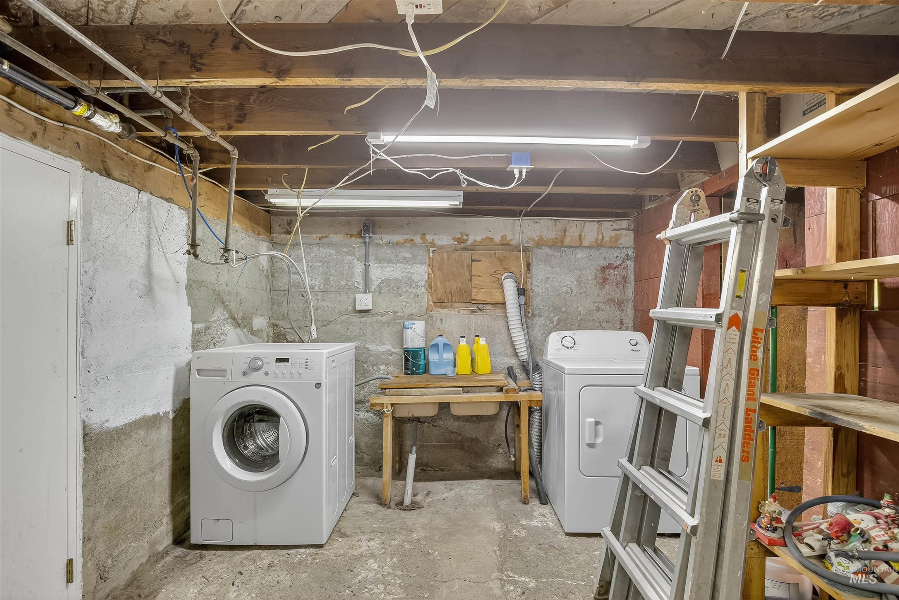Laundry area featuring separate washer and dryer