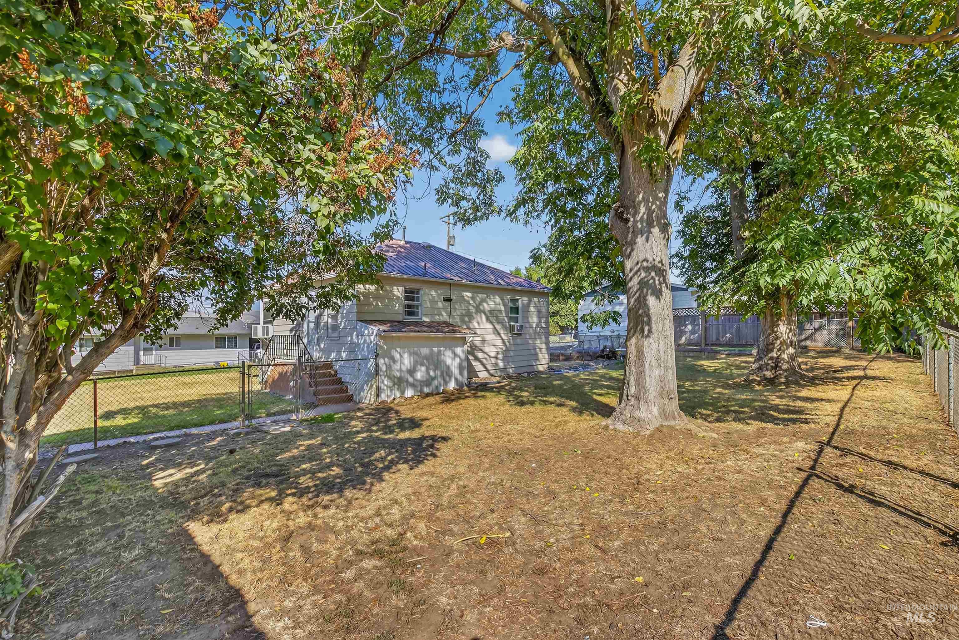 View of fenced backyard