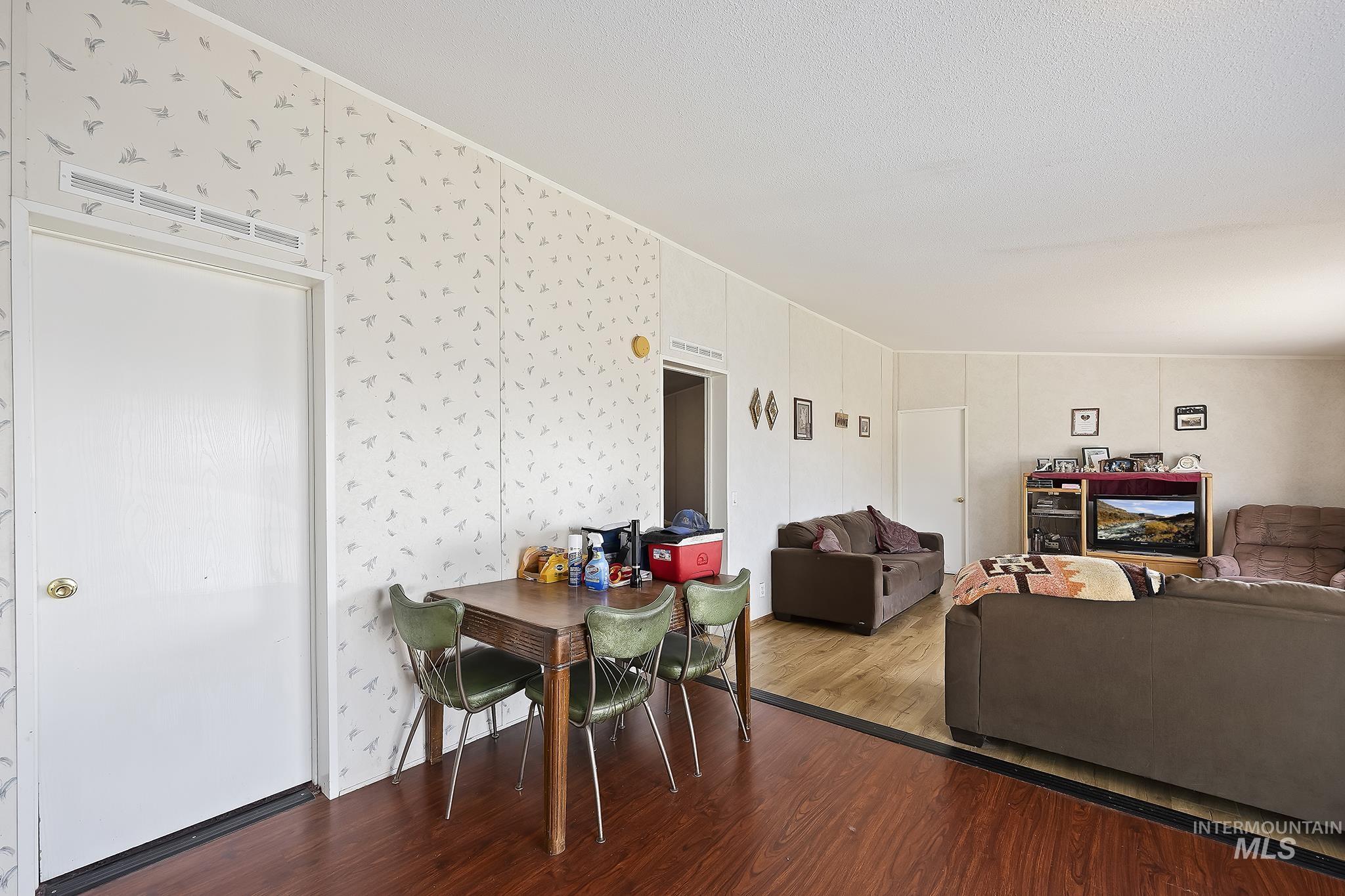 Dining space with wood finished floors