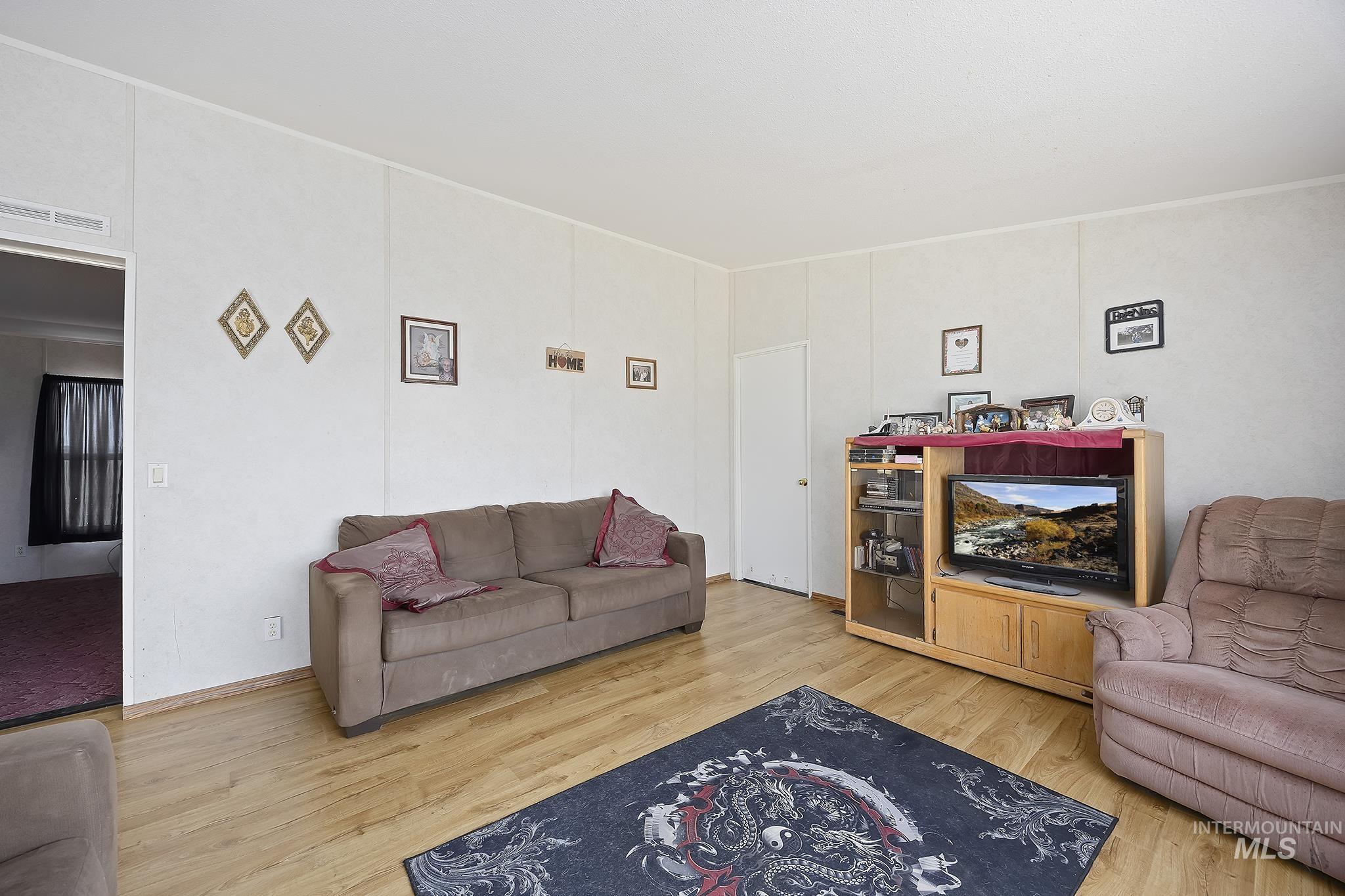 Living area featuring light wood-style flooring