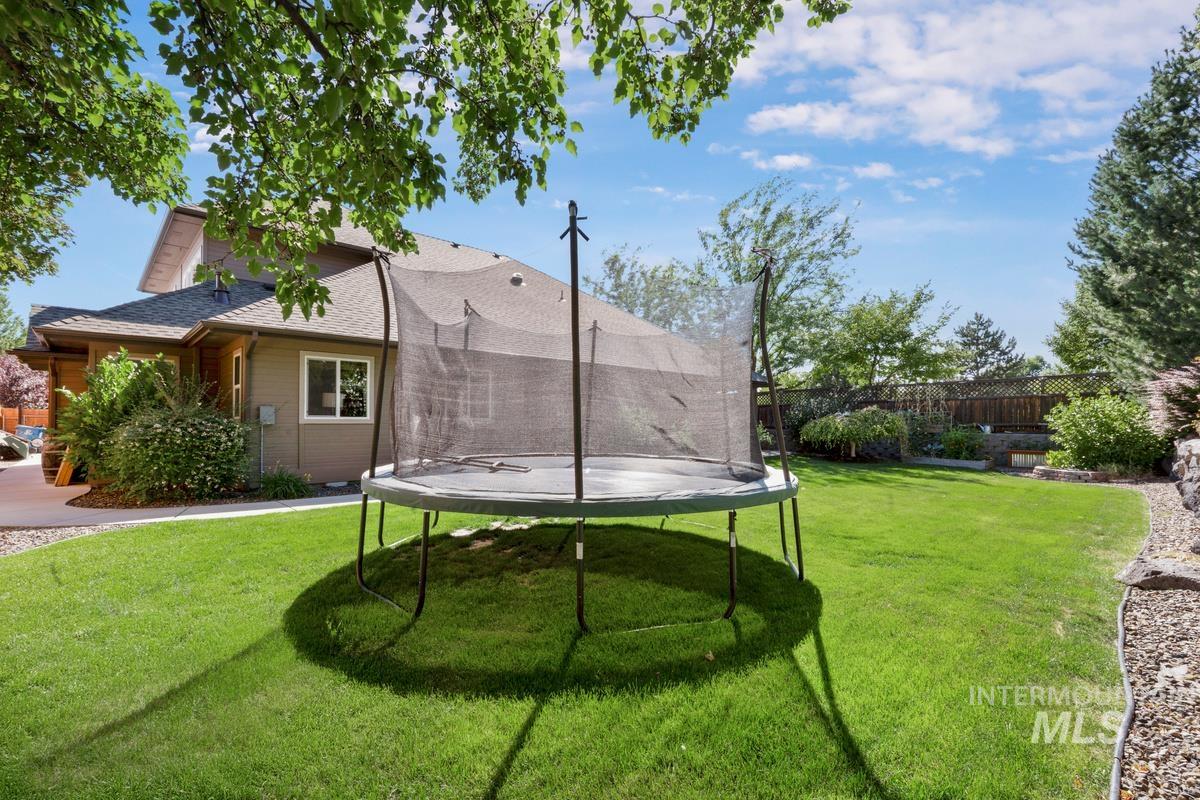 View of yard with a trampoline