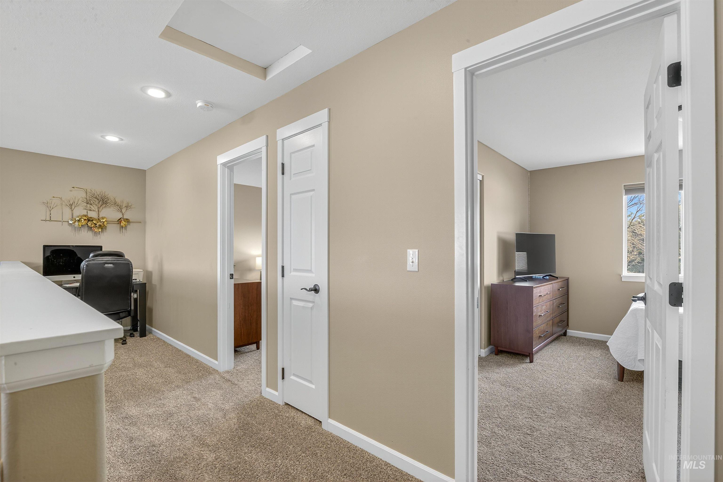 Office with light carpet, attic access, and recessed lighting