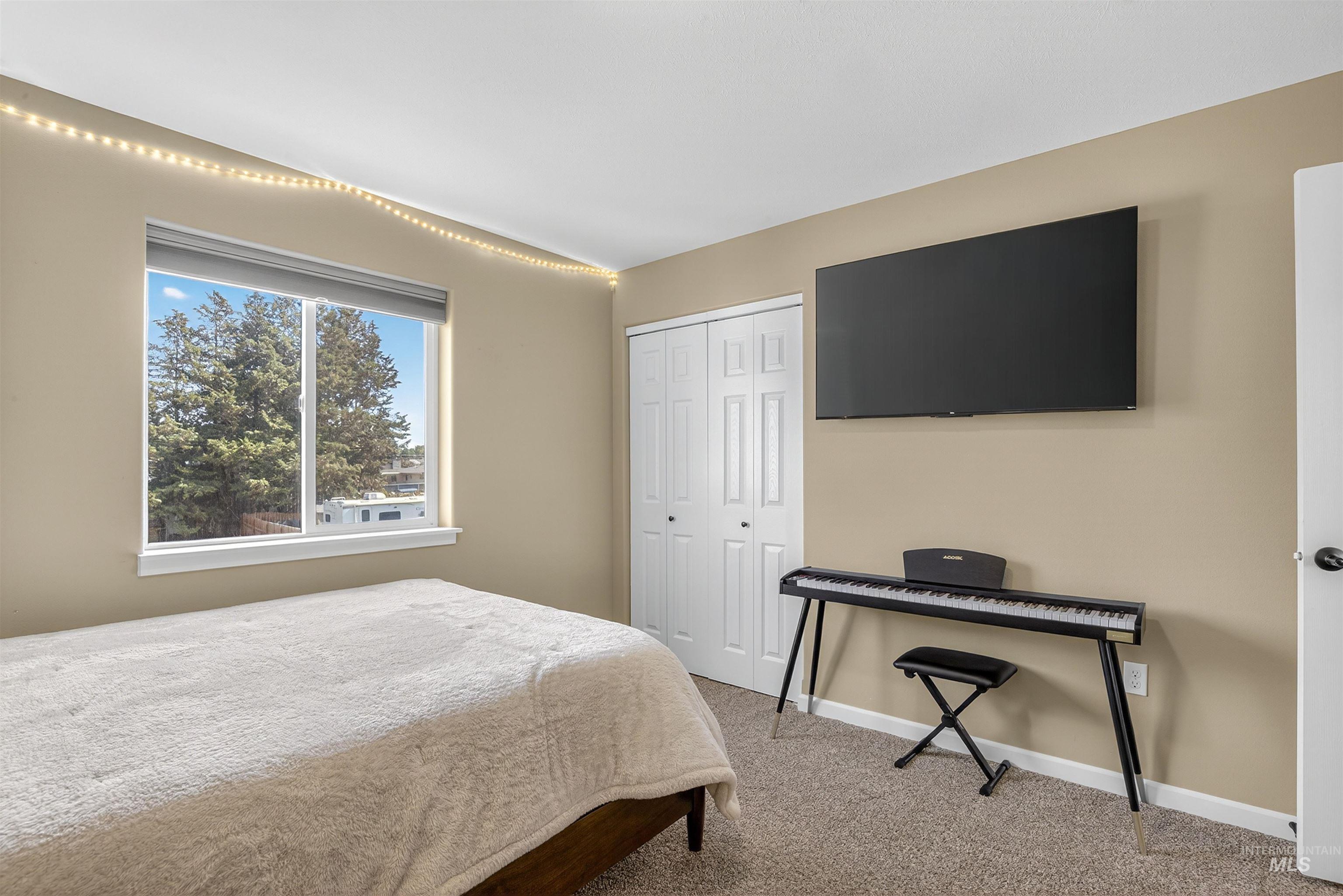 Bedroom with carpet floors and a closet
