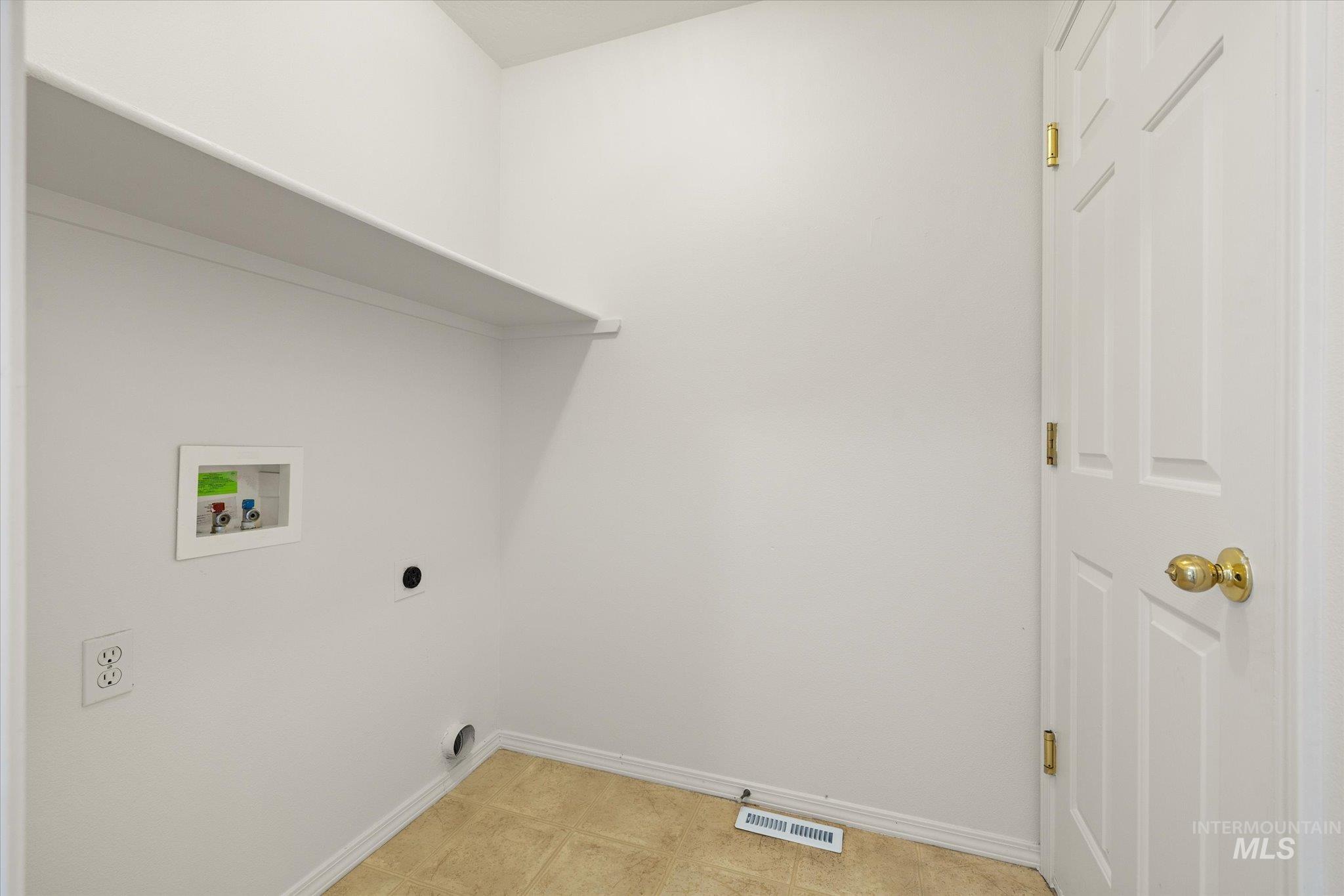 Laundry room with washer hookup and electric dryer hookup