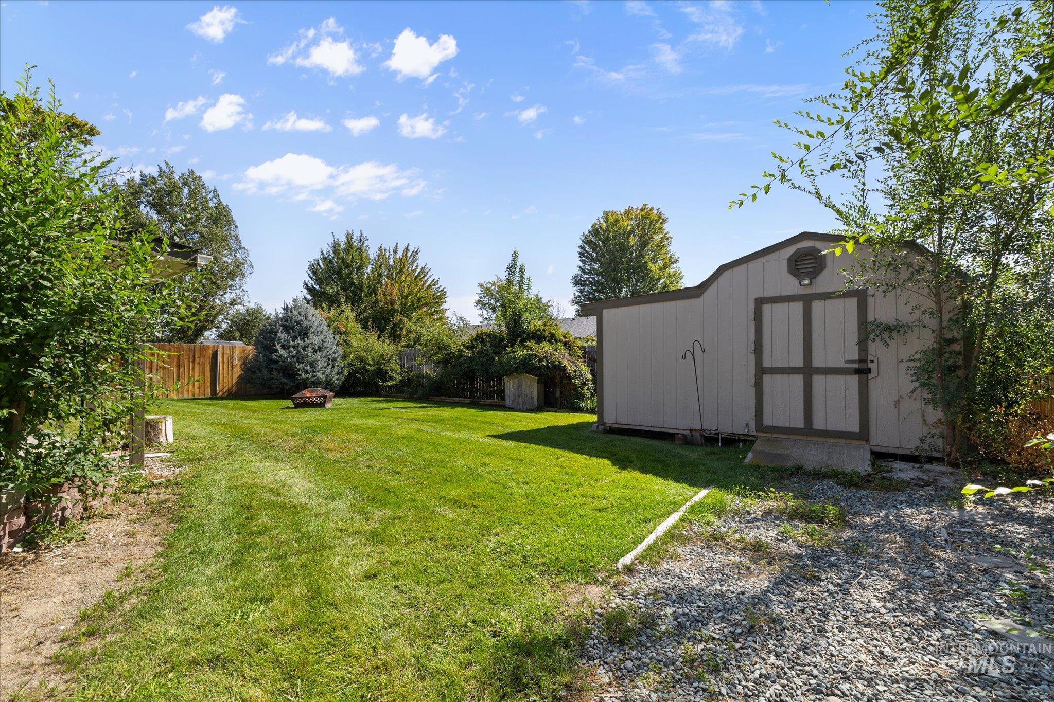 View of yard featuring a shed