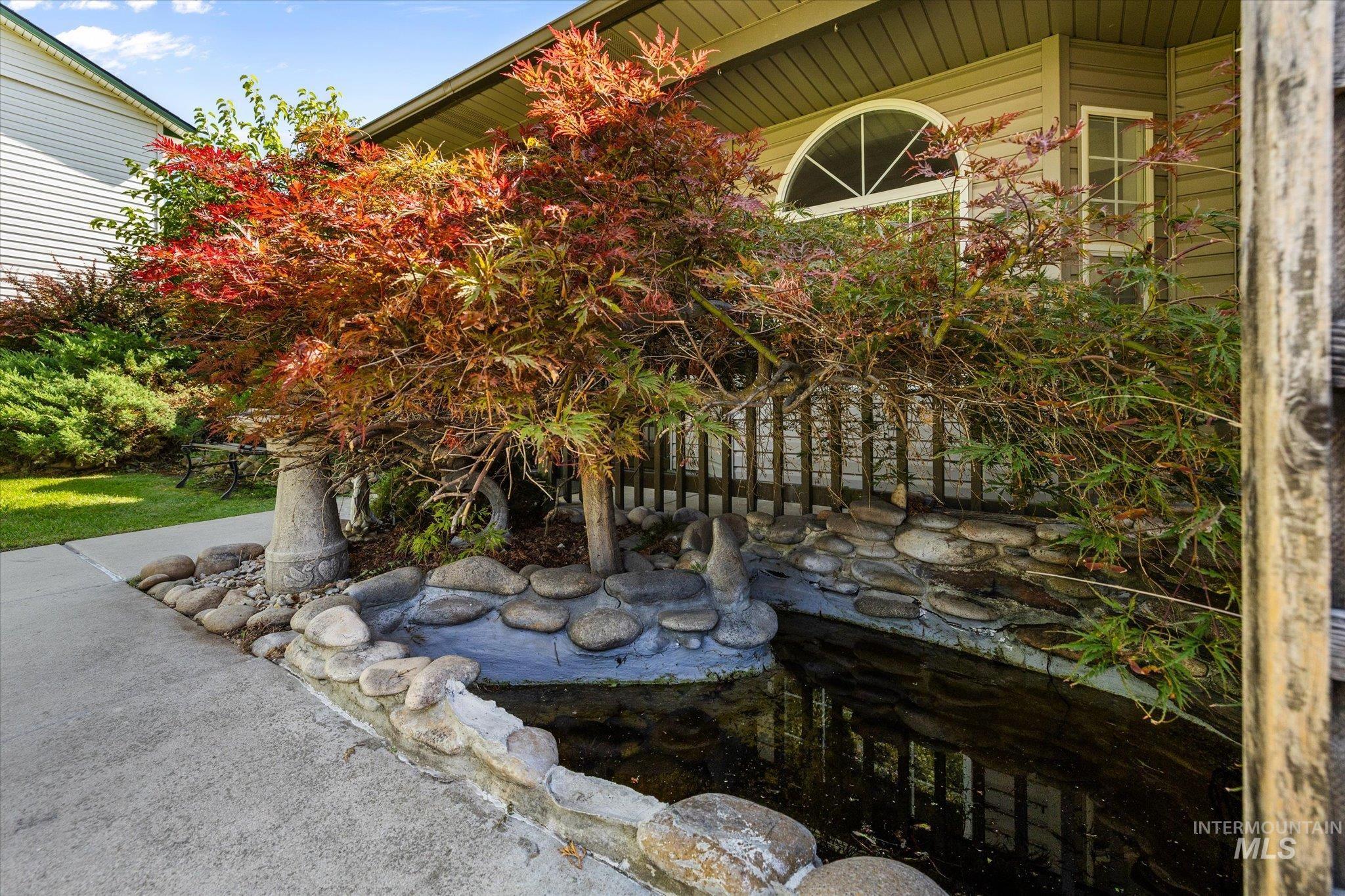 View of yard featuring a garden pond
